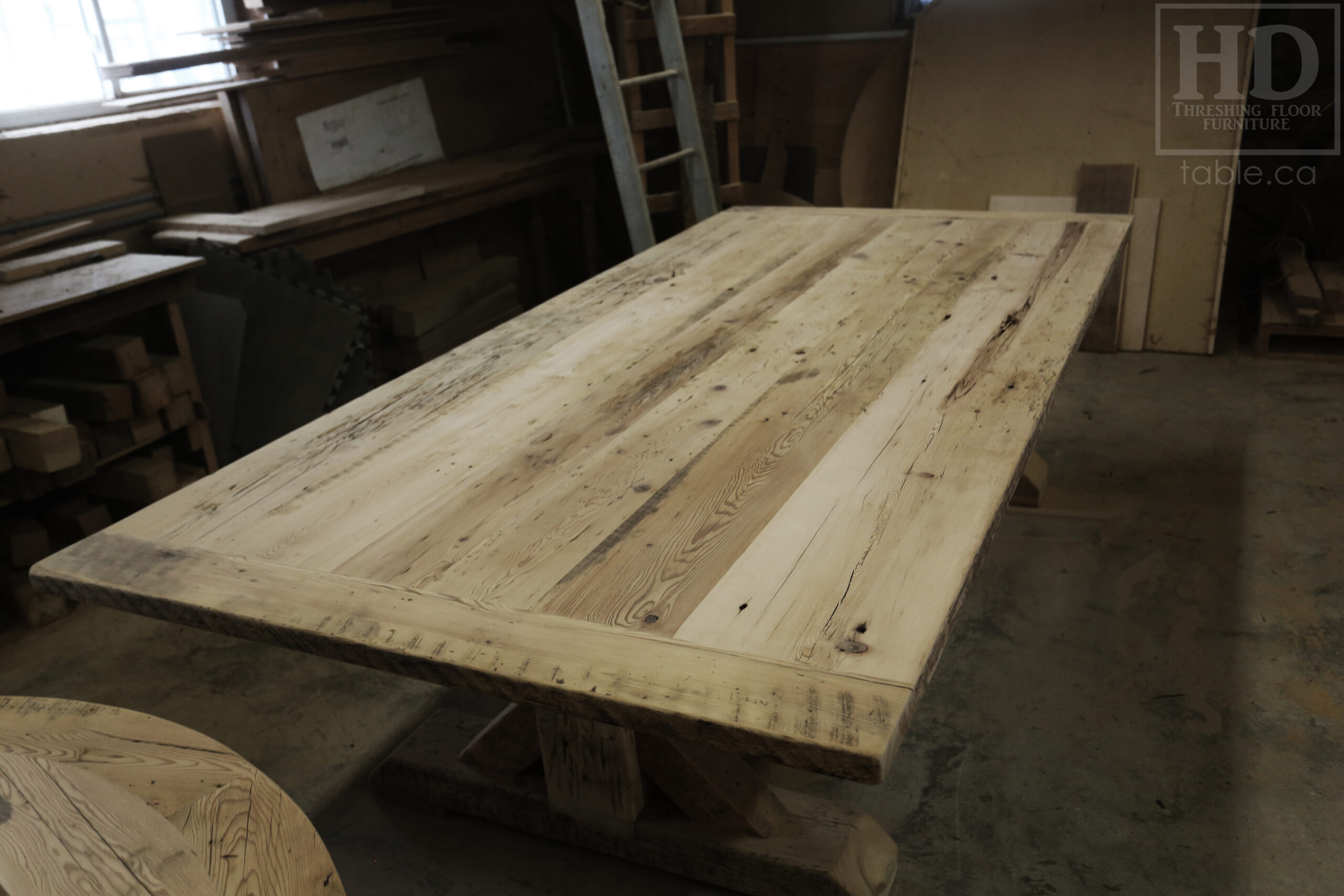 Project Summary: 9.5’ Reclaimed Ontario Barnwood Table we made for a Rockwood, Ontario home – 4.5’ wide – Sawbuck Base [Beam Type Option] - Old Growth Hemlock Threshing Floor Construction - Original edges & distressing maintained – Bread Edge Boards – Premium epoxy + matte polyurethane finish -  www.table.ca