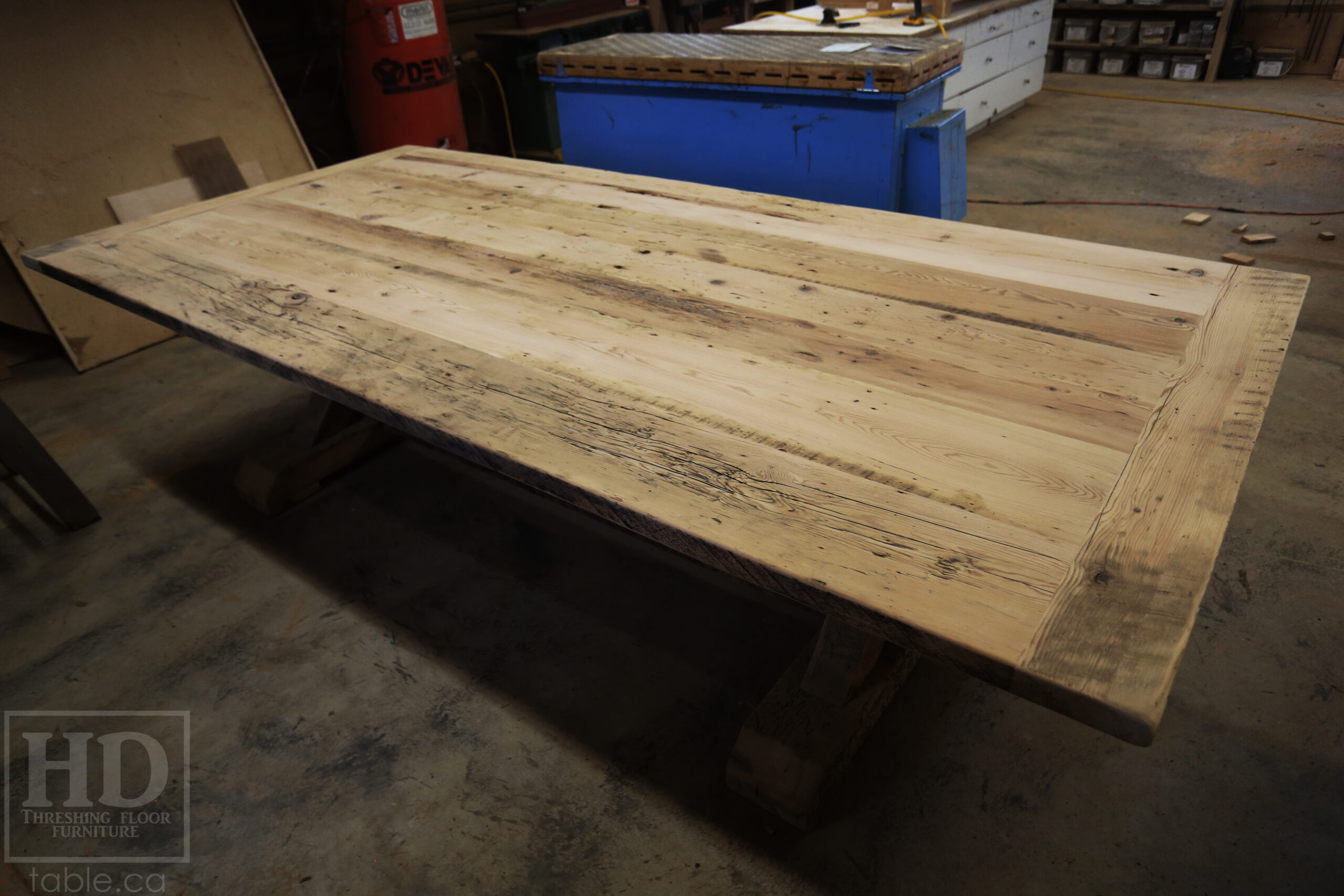 Project Summary: 9.5â€™ Reclaimed Ontario Barnwood Table we made for a Rockwood, Ontario home â€“ 4.5â€™ wide â€“ Sawbuck Base [Beam Type Option] - Old Growth Hemlock Threshing Floor Construction - Original edges & distressing maintained â€“ Bread Edge Boards â€“ Premium epoxy + matte polyurethane finish -  www.table.ca