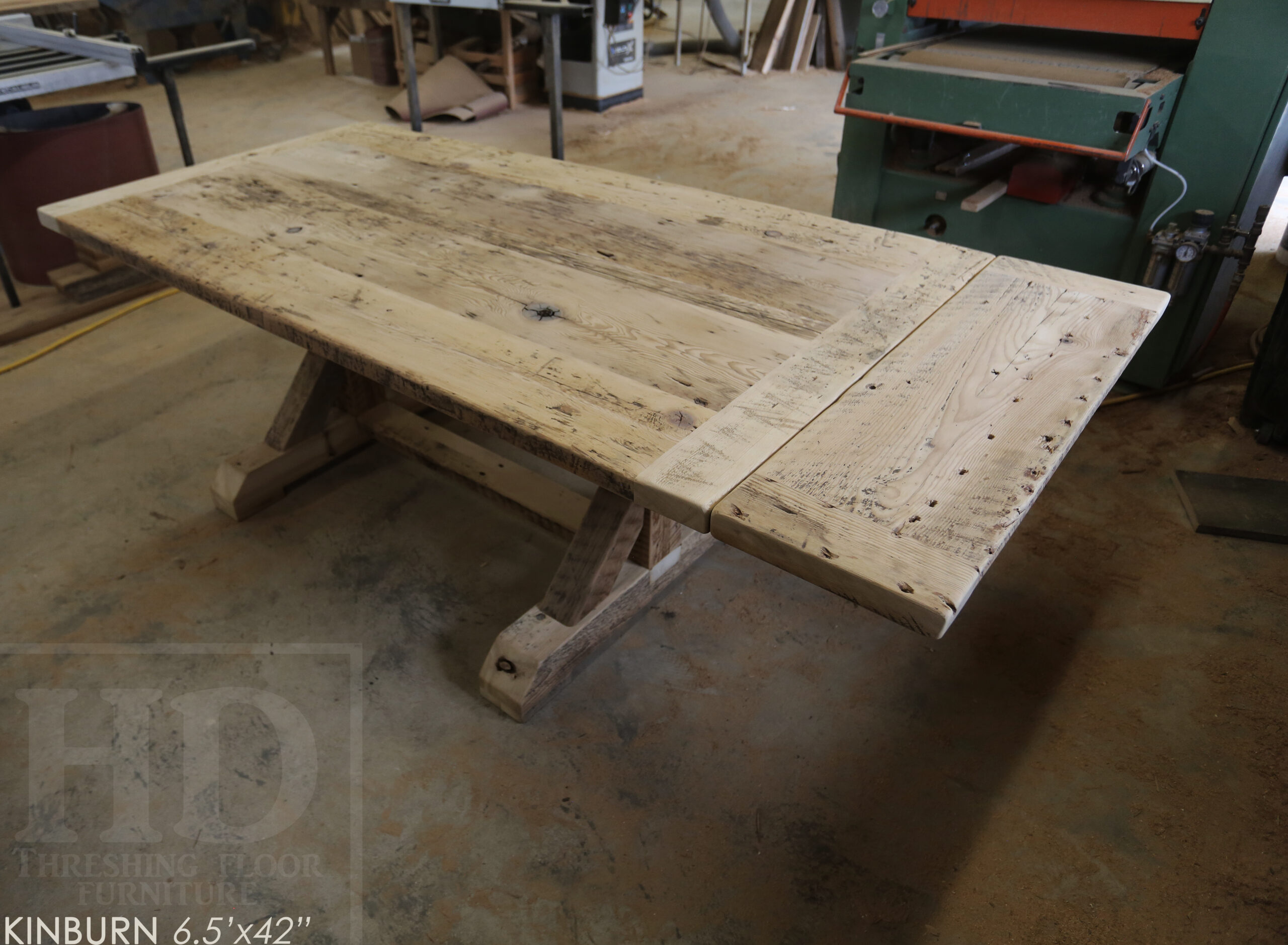 Project Summary: 6.5’ Reclaimed Barnwood Table we made for a Pakenham, Ontario home – 42” wide - Sawbuck Beam Option Base - Old Growth Hemlock Threshing Floor 2” Construction - Original edges & distressing maintained – Bread Edge Boards – Premium epoxy [light coating / less thick option] + satin polyurethane finish – One 12” Leaf – Wormy Maple Athena Chairs / Painted Solid Black - www.table.ca