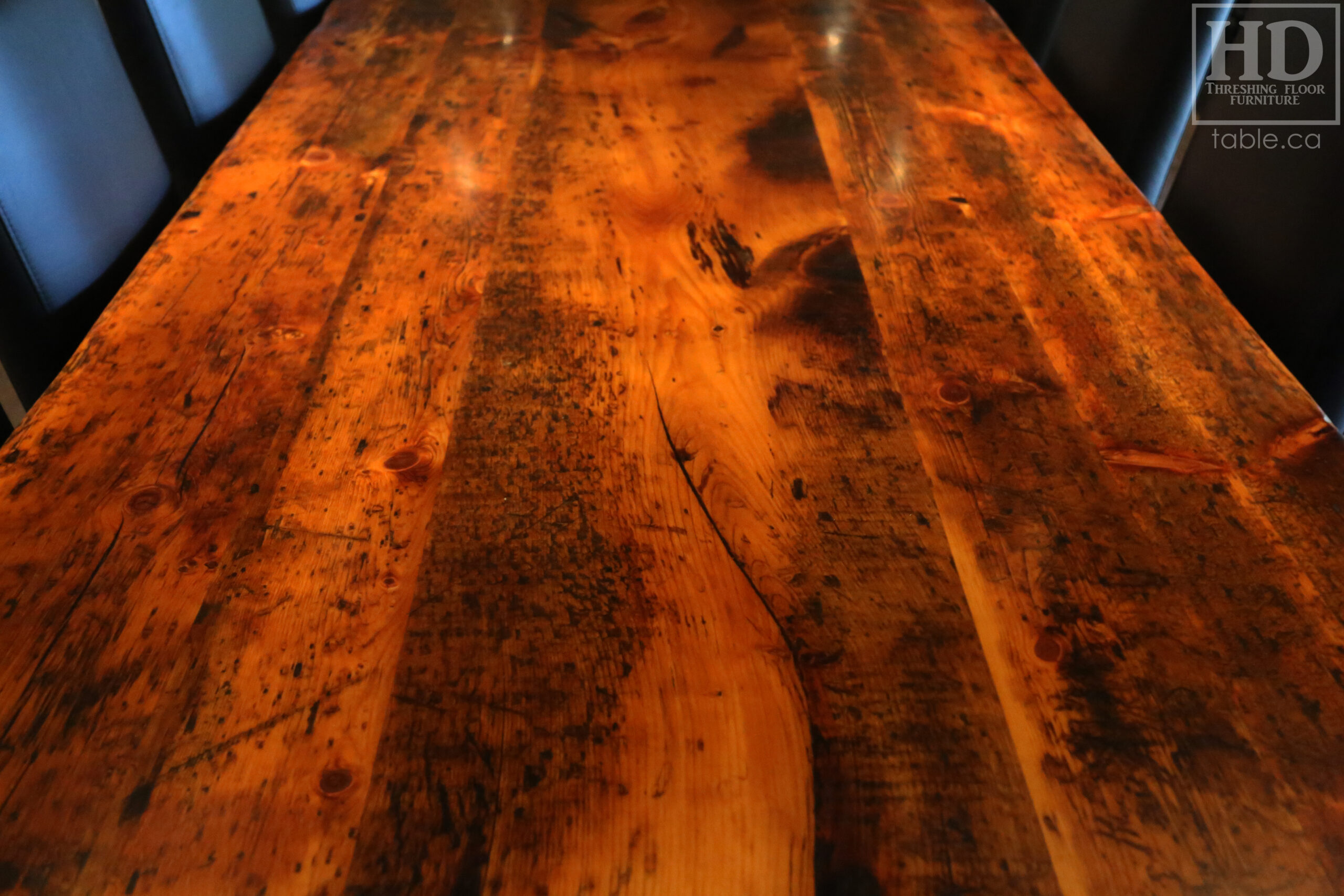 Project Summary: 12â€™ Reclaimed Ontario Barnwood Harvest Table â€“ Tapered with a Notch Windbrace Beam Legs - Old Growth Hemlock Threshing Floor 2â€ Construction - Original edges & distressing maintained â€“ Bread Edge Boards â€“- Premium epoxy + satin polyurethane finish - www.table.ca