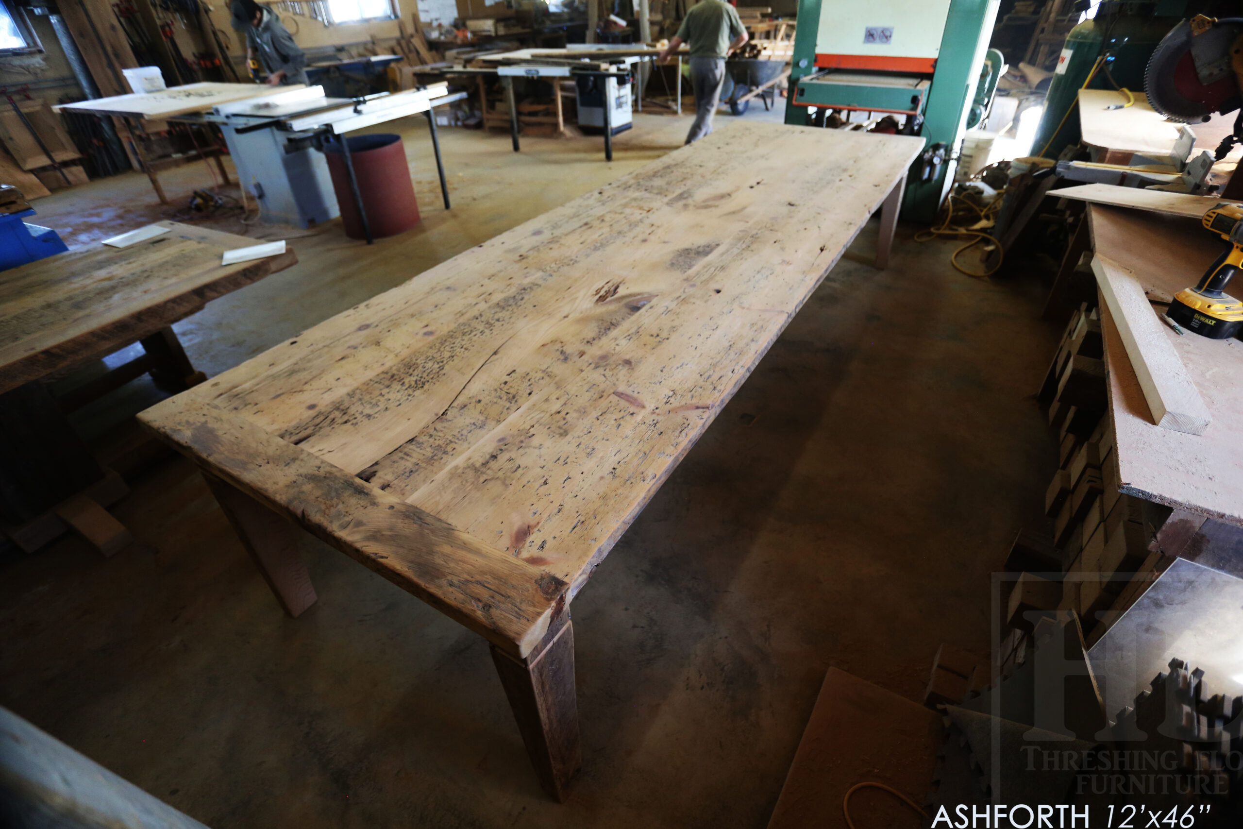 Project Summary: 12â€™ Reclaimed Ontario Barnwood Harvest Table â€“ Tapered with a Notch Windbrace Beam Legs - Old Growth Hemlock Threshing Floor 2â€ Construction - Original edges & distressing maintained â€“ Bread Edge Boards â€“- Premium epoxy + satin polyurethane finish - www.table.ca