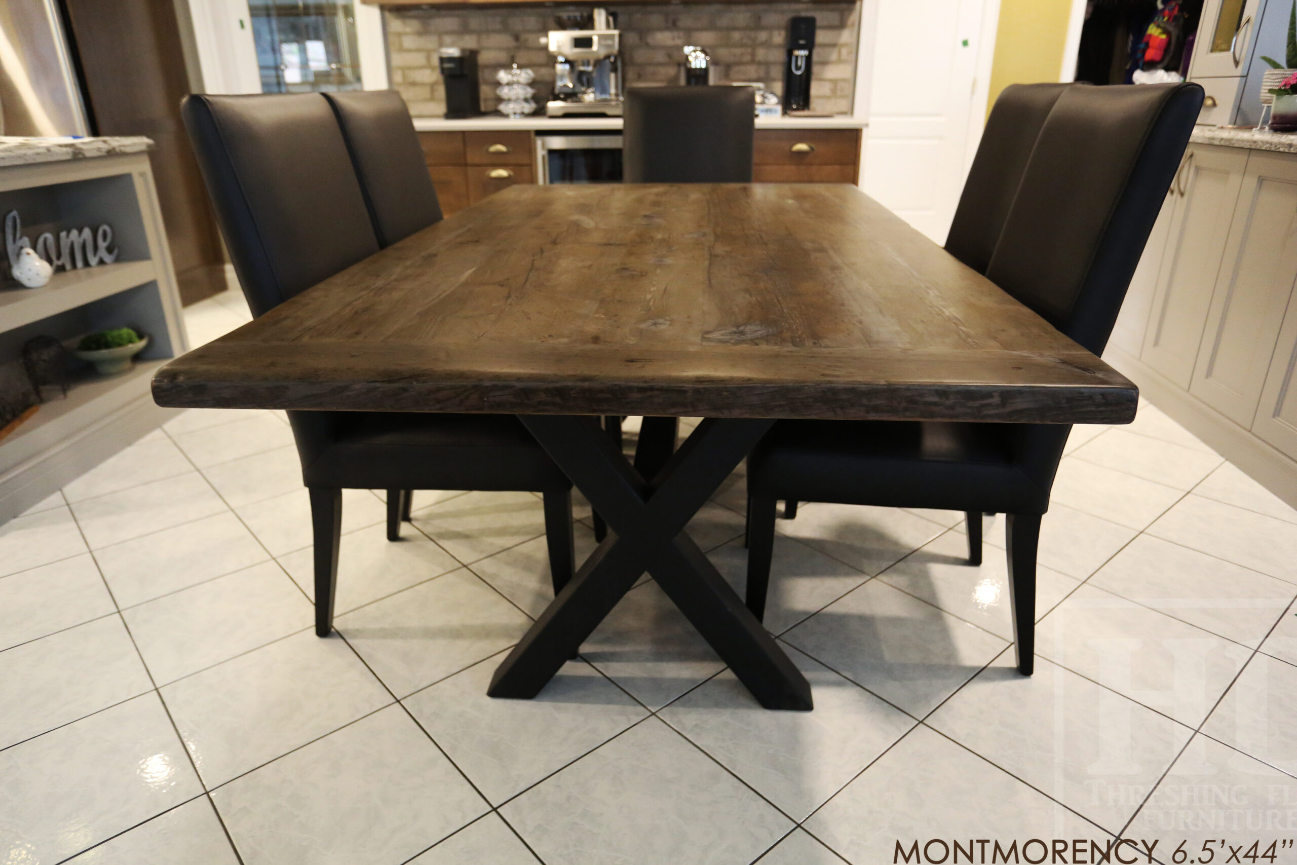 Project Summary: 6.5’ Reclaimed Ontario Barnwood Table we made for a Hamilton, Ontario home – 44” wide –X Shaped Matte Black Base - Old Growth Hemlock Threshing Floor Construction - Original edges & distressing maintained – Bread Edge Boards – Barnboard Grey Option - Premium epoxy + satin polyurethane finish – 8 V Back Topgrain Leather Parsons Chairs / Black - www.table.ca
