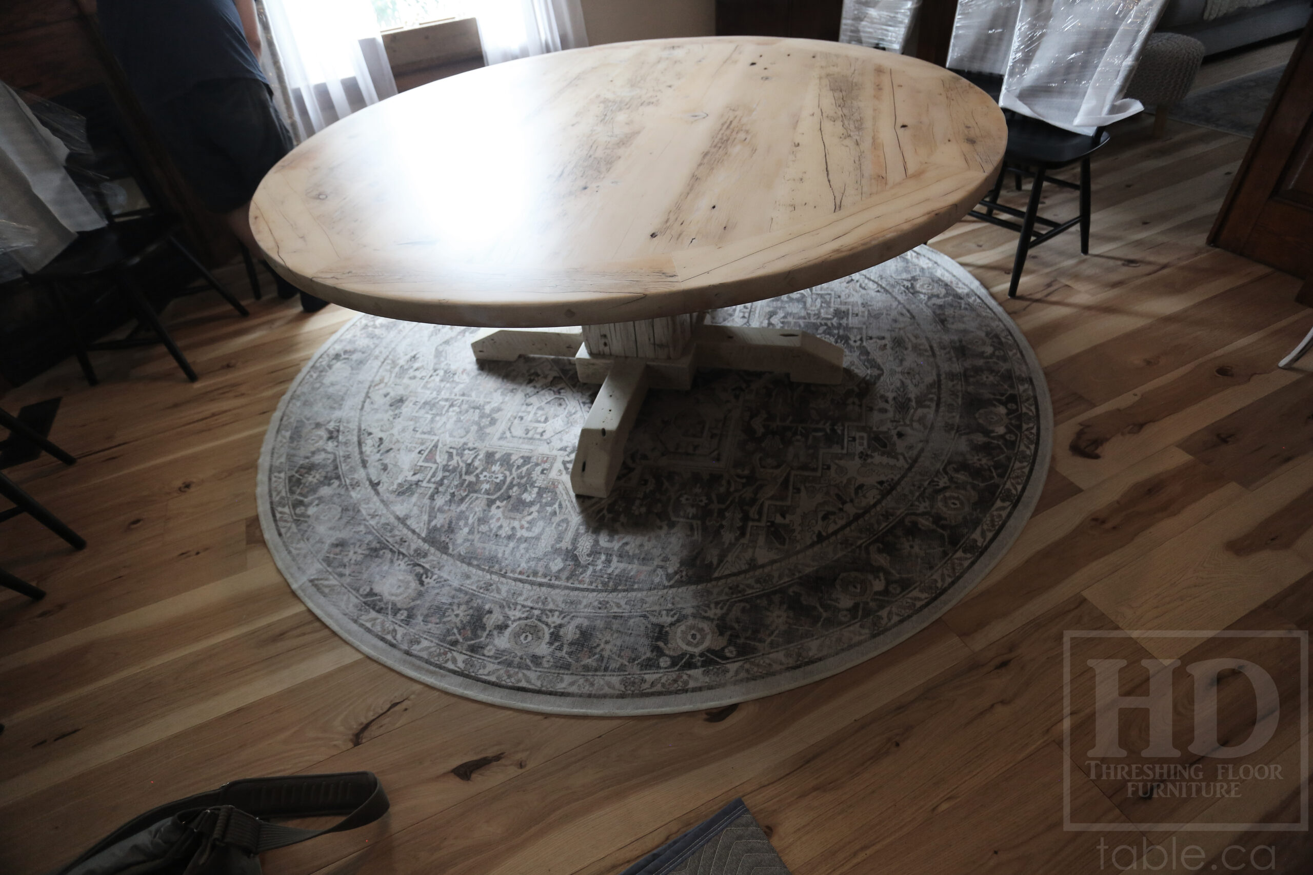 Project Summary: 72â€ Reclaimed Ontario Barnwood Round Table we made for a Cambridge, Ontario home â€“ Hand Hewn Beam Pedestal Base - Old Growth Hemlock Threshing Floor Construction - Original edges & distressing maintained â€“ Bread Edge Boards â€“ Bleached Option - Premium epoxy + matte polyurethane finish - www.table.ca