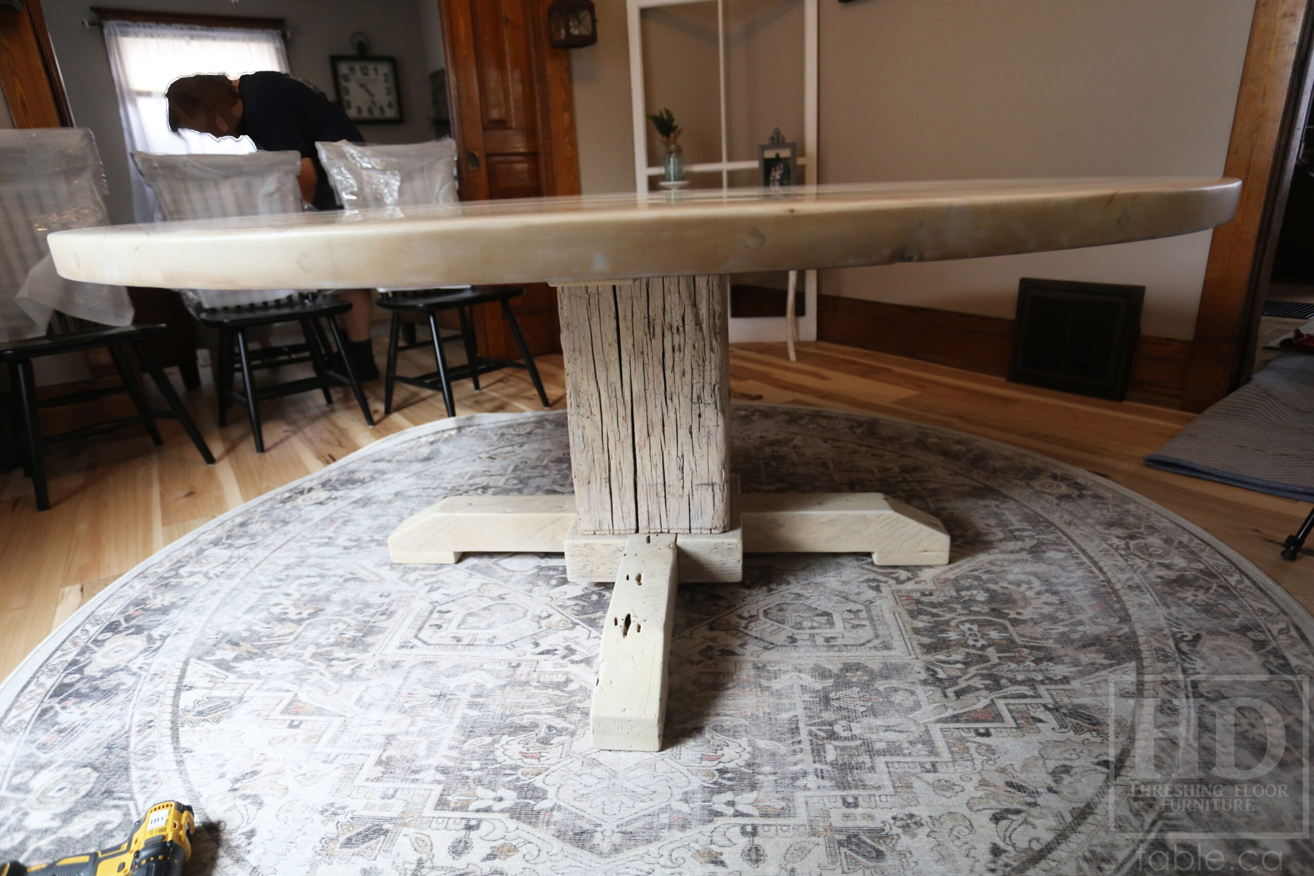 Project Summary: 72â€ Reclaimed Ontario Barnwood Round Table we made for a Cambridge, Ontario home â€“ Hand Hewn Beam Pedestal Base - Old Growth Hemlock Threshing Floor Construction - Original edges & distressing maintained â€“ Bread Edge Boards â€“ Bleached Option - Premium epoxy + matte polyurethane finish - www.table.ca