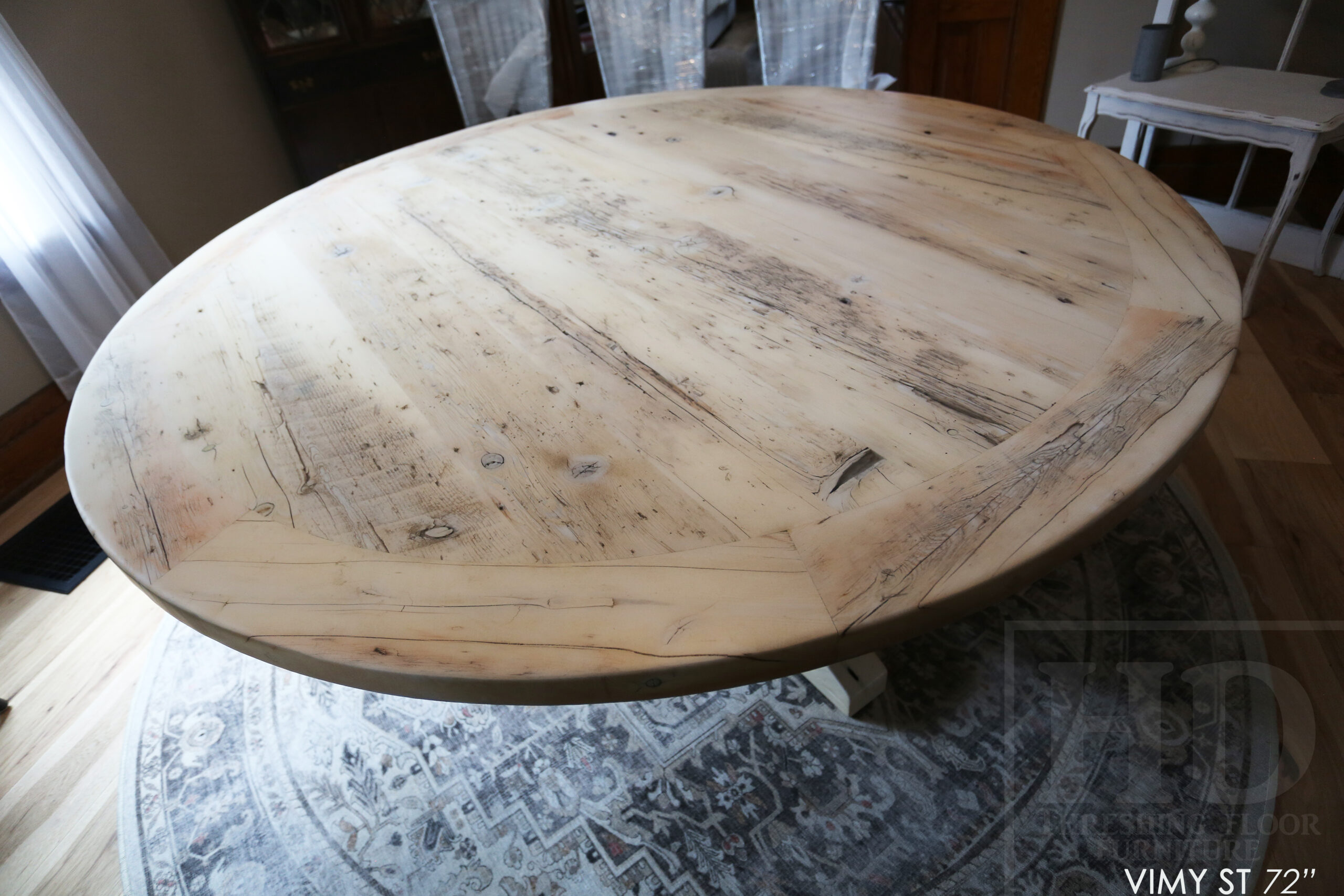 Project Summary: 72â€ Reclaimed Ontario Barnwood Round Table we made for a Cambridge, Ontario home â€“ Hand Hewn Beam Pedestal Base - Old Growth Hemlock Threshing Floor Construction - Original edges & distressing maintained â€“ Bread Edge Boards â€“ Bleached Option - Premium epoxy + matte polyurethane finish - www.table.ca