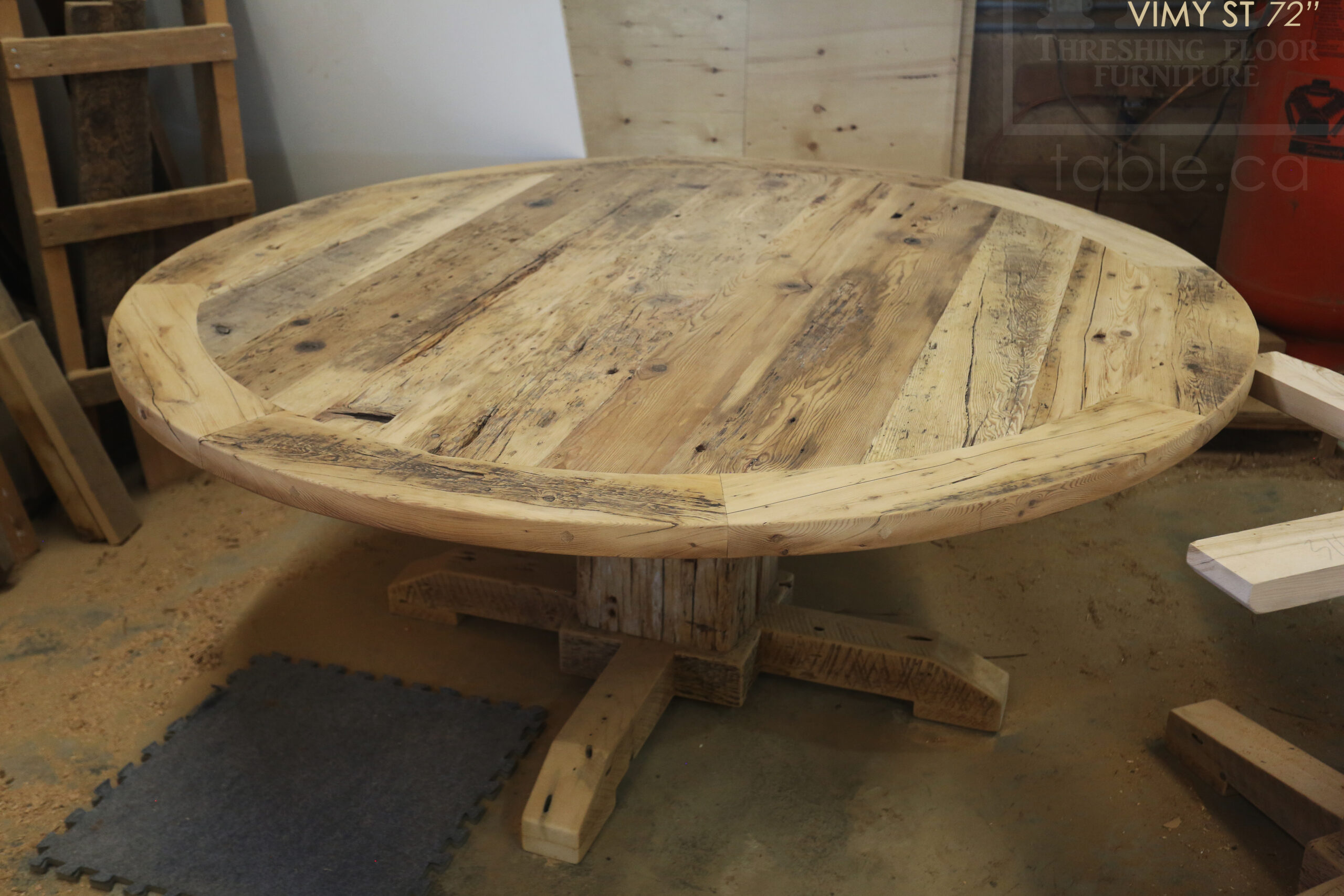 Project Summary: 72â€ Reclaimed Ontario Barnwood Round Table we made for a Cambridge, Ontario home â€“ Hand Hewn Beam Pedestal Base - Old Growth Hemlock Threshing Floor Construction - Original edges & distressing maintained â€“ Bread Edge Boards â€“ Bleached Option - Premium epoxy + matte polyurethane finish - www.table.ca