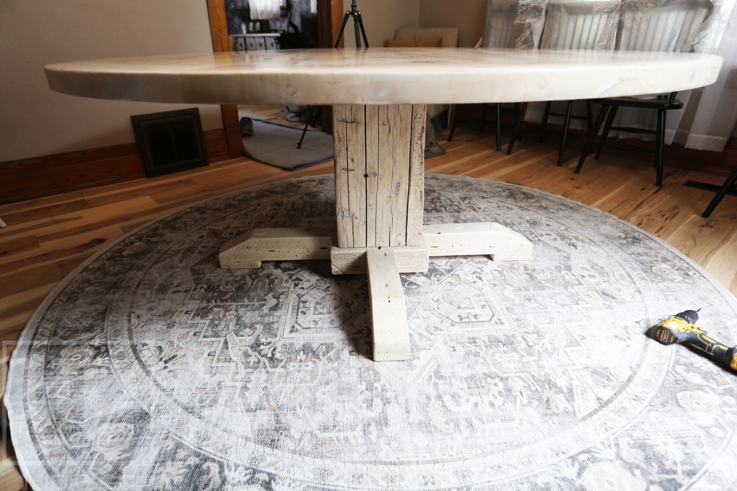 Project Summary: 72â€ Reclaimed Ontario Barnwood Round Table we made for a Cambridge, Ontario home â€“ Hand Hewn Beam Pedestal Base - Old Growth Hemlock Threshing Floor Construction - Original edges & distressing maintained â€“ Bread Edge Boards â€“ Bleached Option - Premium epoxy + matte polyurethane finish - www.table.ca