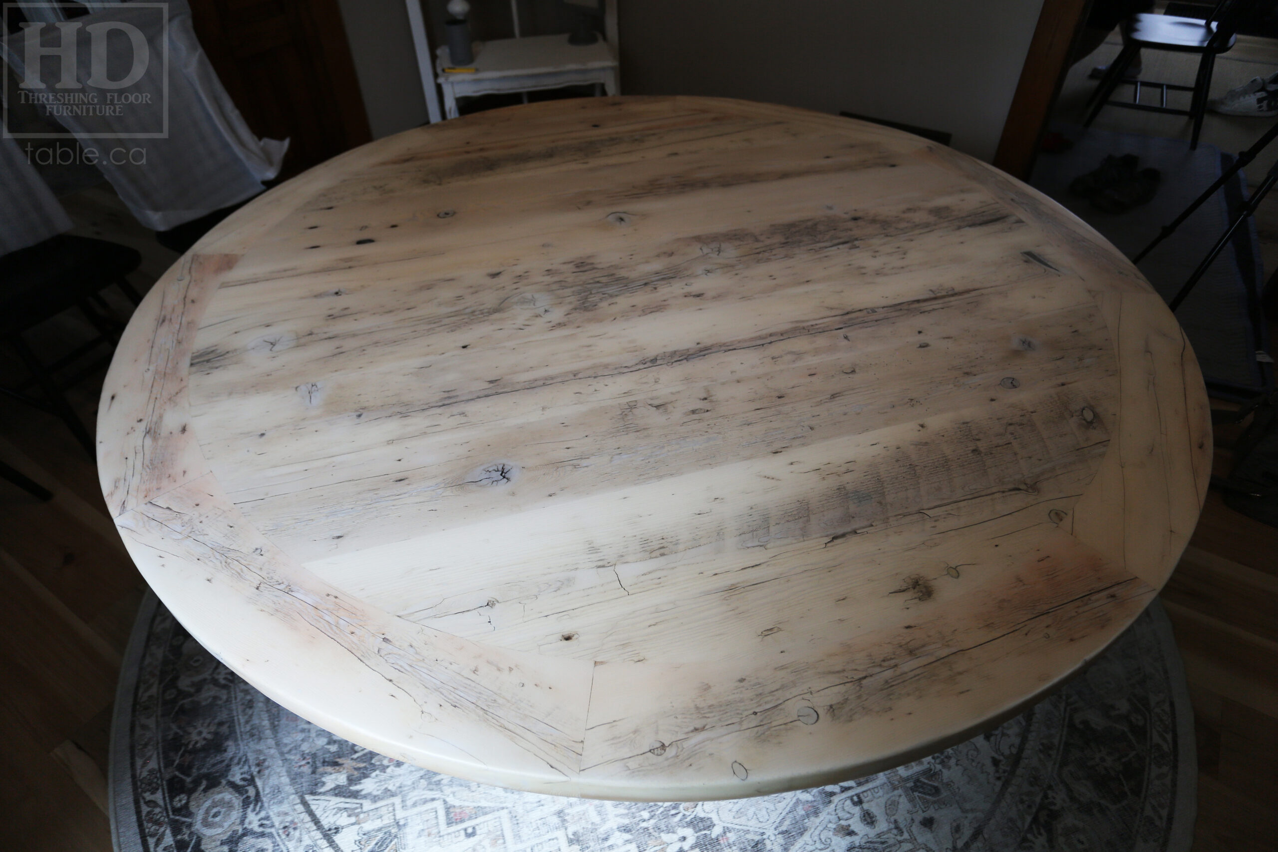 Project Summary: 72â€ Reclaimed Ontario Barnwood Round Table we made for a Cambridge, Ontario home â€“ Hand Hewn Beam Pedestal Base - Old Growth Hemlock Threshing Floor Construction - Original edges & distressing maintained â€“ Bread Edge Boards â€“ Bleached Option - Premium epoxy + matte polyurethane finish - www.table.ca