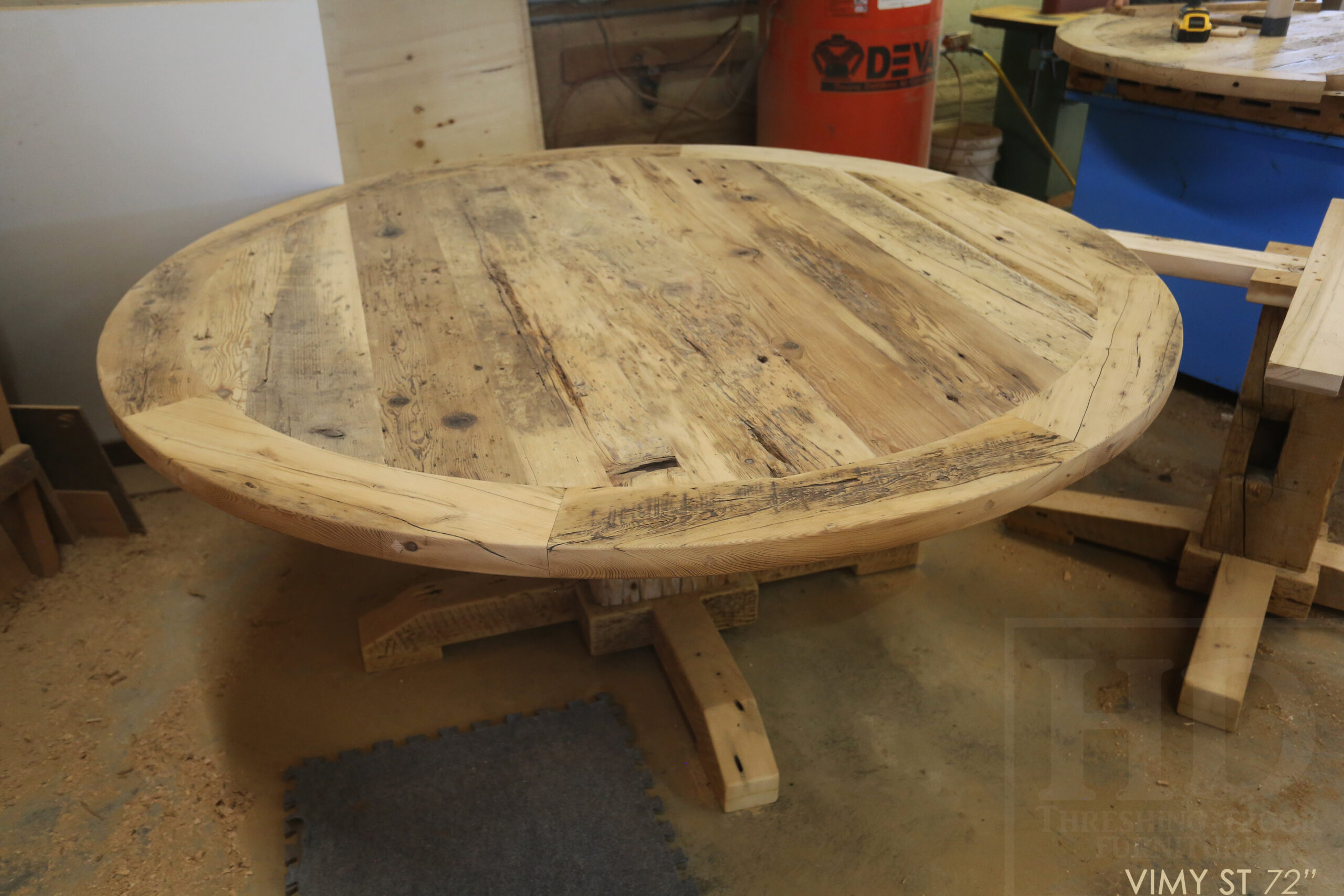 Project Summary: 72” Reclaimed Ontario Barnwood Round Table we made for a Cambridge, Ontario home – Hand Hewn Beam Pedestal Base - Old Growth Hemlock Threshing Floor Construction - Original edges & distressing maintained – Bread Edge Boards – Bleached Option - Premium epoxy + matte polyurethane finish - www.table.ca
