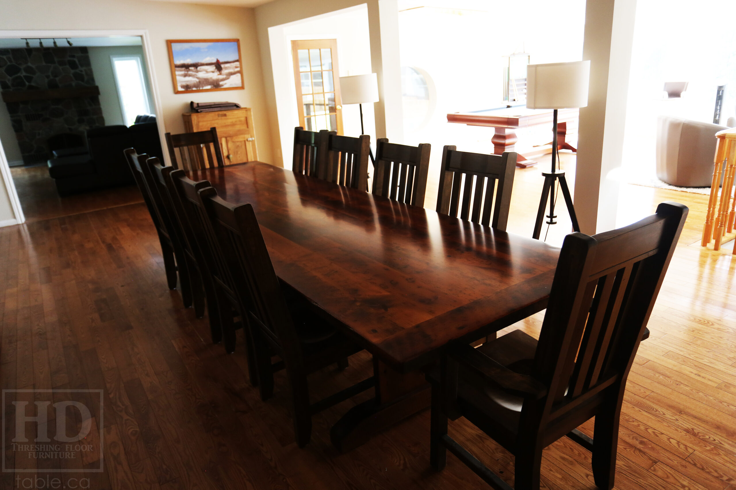 Project Summary: 12’ Reclaimed Ontario Barnwood Table we made for a Goodwood, Ontario home – 42” wide – Trestle Base - Old Growth Hemlock Threshing Floor Construction - Original edges & distressing maintained – Bread Edge Boards - Premium epoxy + satin polyurethane finish – 10 Strongback Chairs / Wormy Maple / Stained Colour of Table / Polyurethane clearcoat finish - www.table.ca