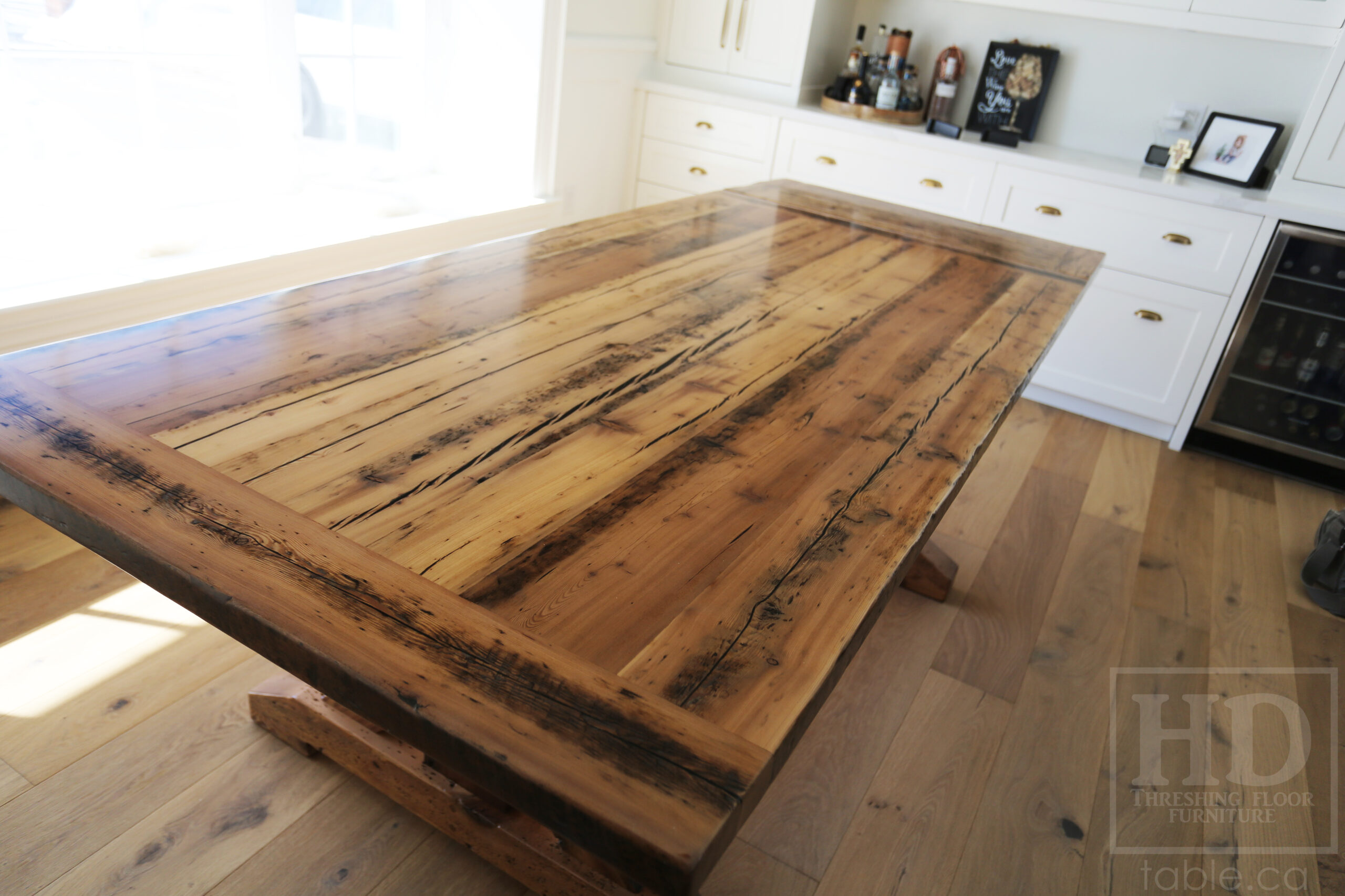 Project Summary: 7’ Reclaimed Ontario Barnwood Table we made for an Oakville, Ontario Home – 42” wide – Sawbuck Base - Old Growth Hemlock Threshing Floor Construction - Original edges & distressing maintained – Bread Edge Boards – Greytone Option - Premium epoxy + satin polyurethane finish – One 18” Leaf – 7’ [matching] Bench - www.table.ca