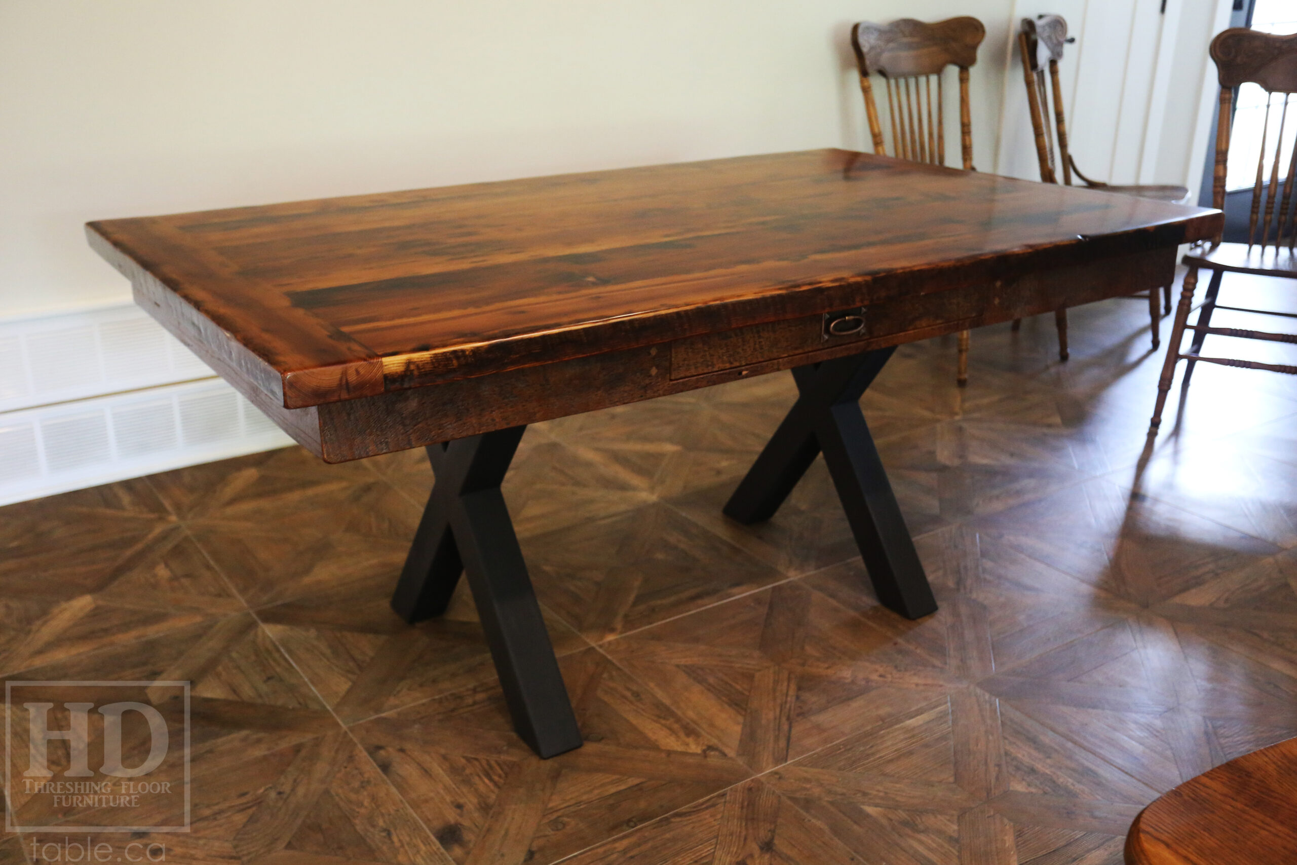 5.5â€™ Ontario Barnwood Table we made for a Dundas, Ontario Home â€“ 40â€ wide â€“ Matte Black X Shaped Base â€“ Skirting + Drawer Option - Old Growth Reclaimed Hemlock Threshing Floor Construction â€“ Original edges & distressing maintained - Premium epoxy + satin polyurethane finish â€“ Two 18â€ leaves - www.table.ca