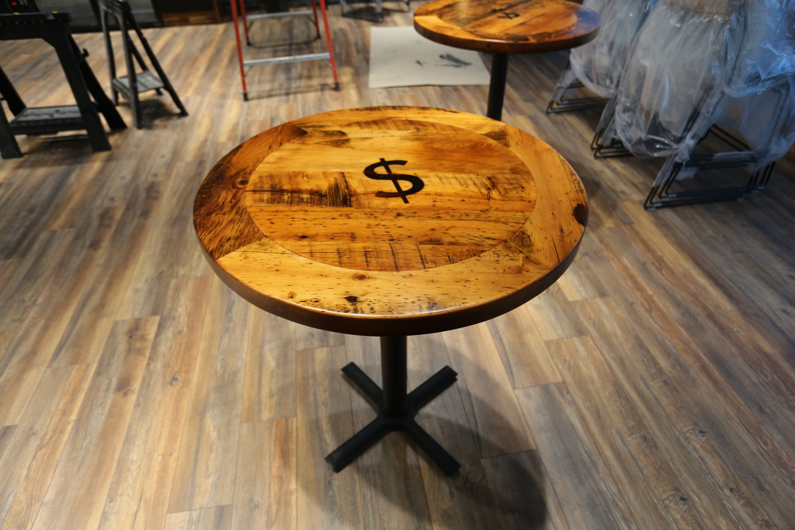 [Ontario Barnwood] Event Tables we made for a Burlington, Ontario Business â€“ Matte Black Metal Bases [provided by Ontario Table & Chair in Waterloo] â€“ Custom branding iron [provide by Summit Laser in Salem] - 2â€ Old Growth Reclaimed Hemlock Threshing Floor Construction Tops â€“ Original distressing & character maintained - Premium epoxy + satin polyurethane finish â€“ www.table.ca
