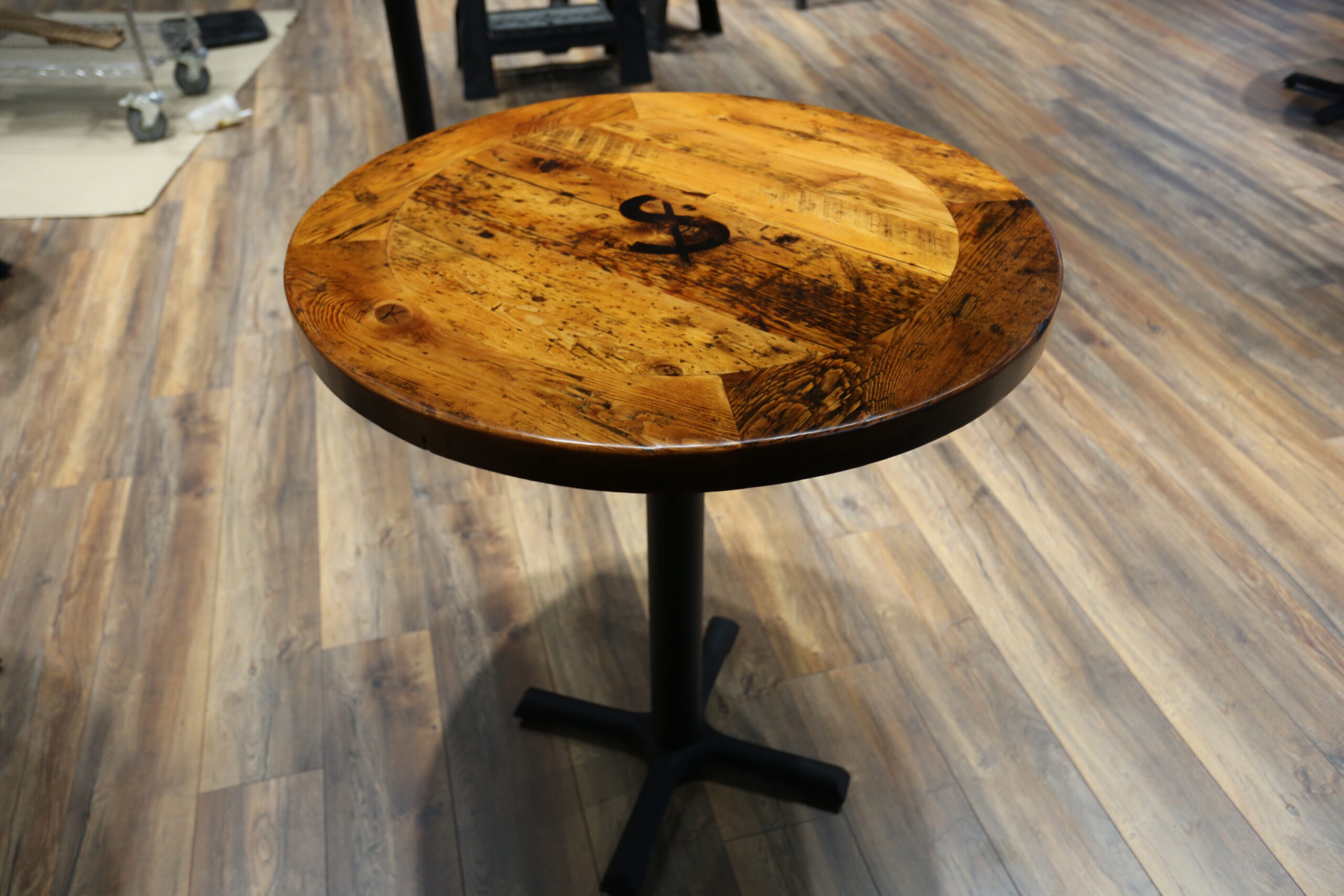 [Ontario Barnwood] Event Tables we made for a Burlington, Ontario Business â€“ Matte Black Metal Bases [provided by Ontario Table & Chair in Waterloo] â€“ Custom branding iron [provide by Summit Laser in Salem] - 2â€ Old Growth Reclaimed Hemlock Threshing Floor Construction Tops â€“ Original distressing & character maintained - Premium epoxy + satin polyurethane finish â€“ www.table.ca