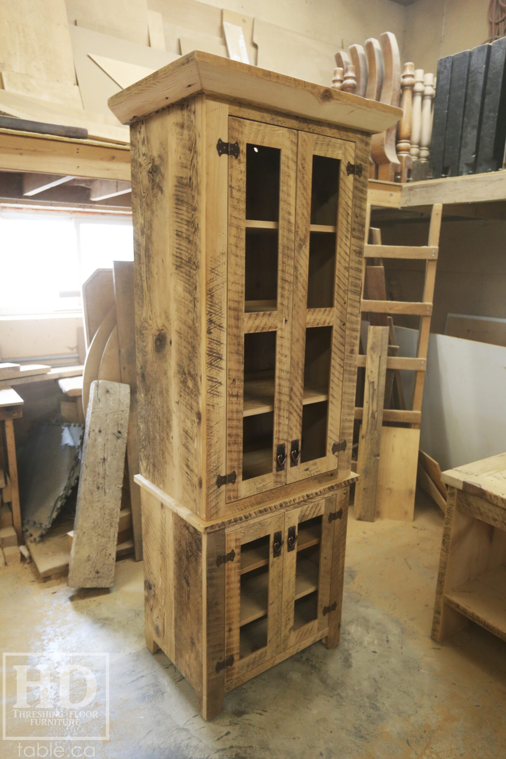 33" Wide Ontario Barnwood Hutch we made for a Guelph Home - 84" height - 20" deep - 2 Top Doors / 2 Bottom Doors / Glass Inserts - Ajustable Shelving Inside - Reclaimed old growth hemlock threshing floor + grainery board construction - Original edges + distressing kept - Mission Cast Brass Lee Valley Hardware - Satin polyurethane finish - www.table.ca