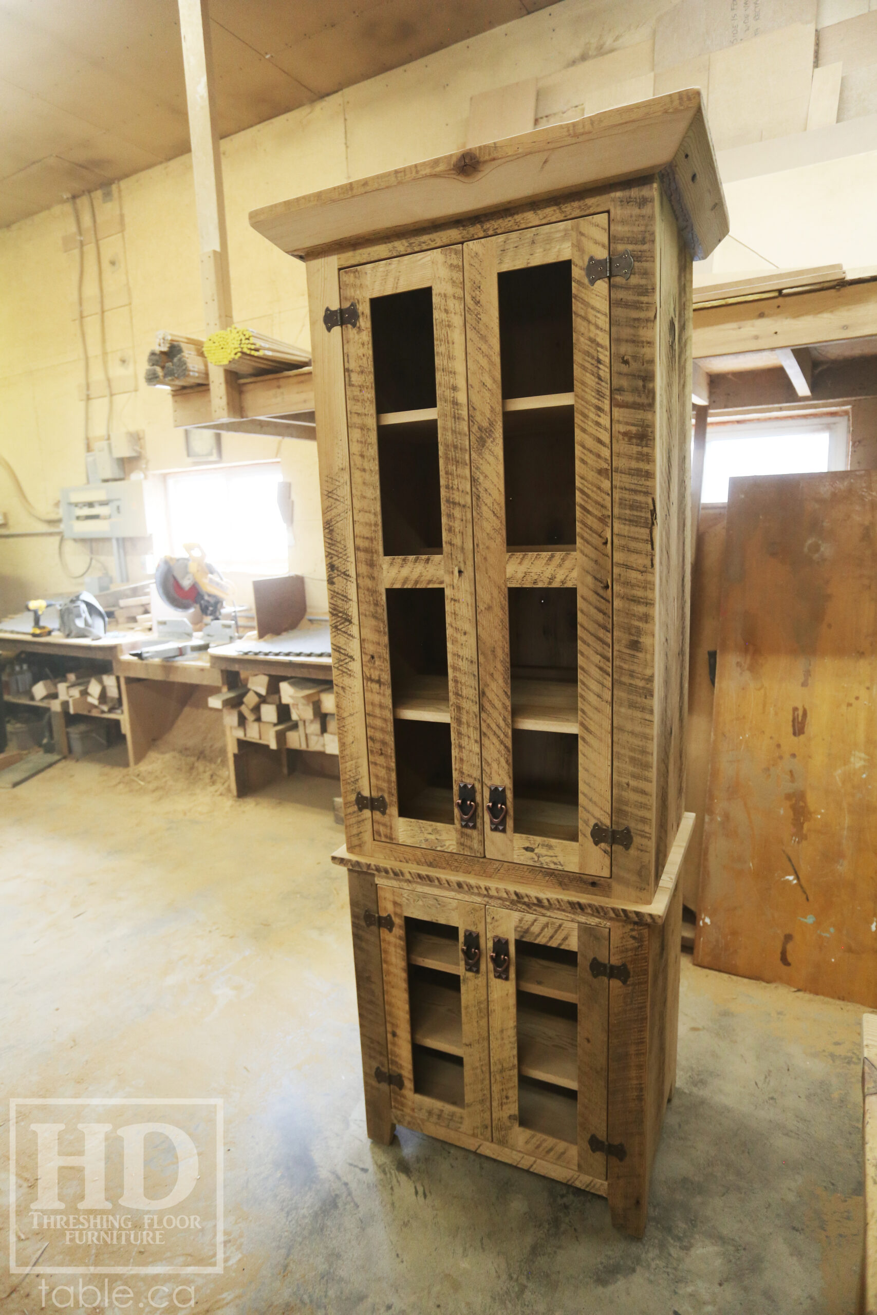 33" Wide Ontario Barnwood Hutch we made for a Guelph Home - 84" height - 20" deep - 2 Top Doors / 2 Bottom Doors / Glass Inserts - Ajustable Shelving Inside - Reclaimed old growth hemlock threshing floor + grainery board construction - Original edges + distressing kept - Mission Cast Brass Lee Valley Hardware - Satin polyurethane finish - www.table.ca