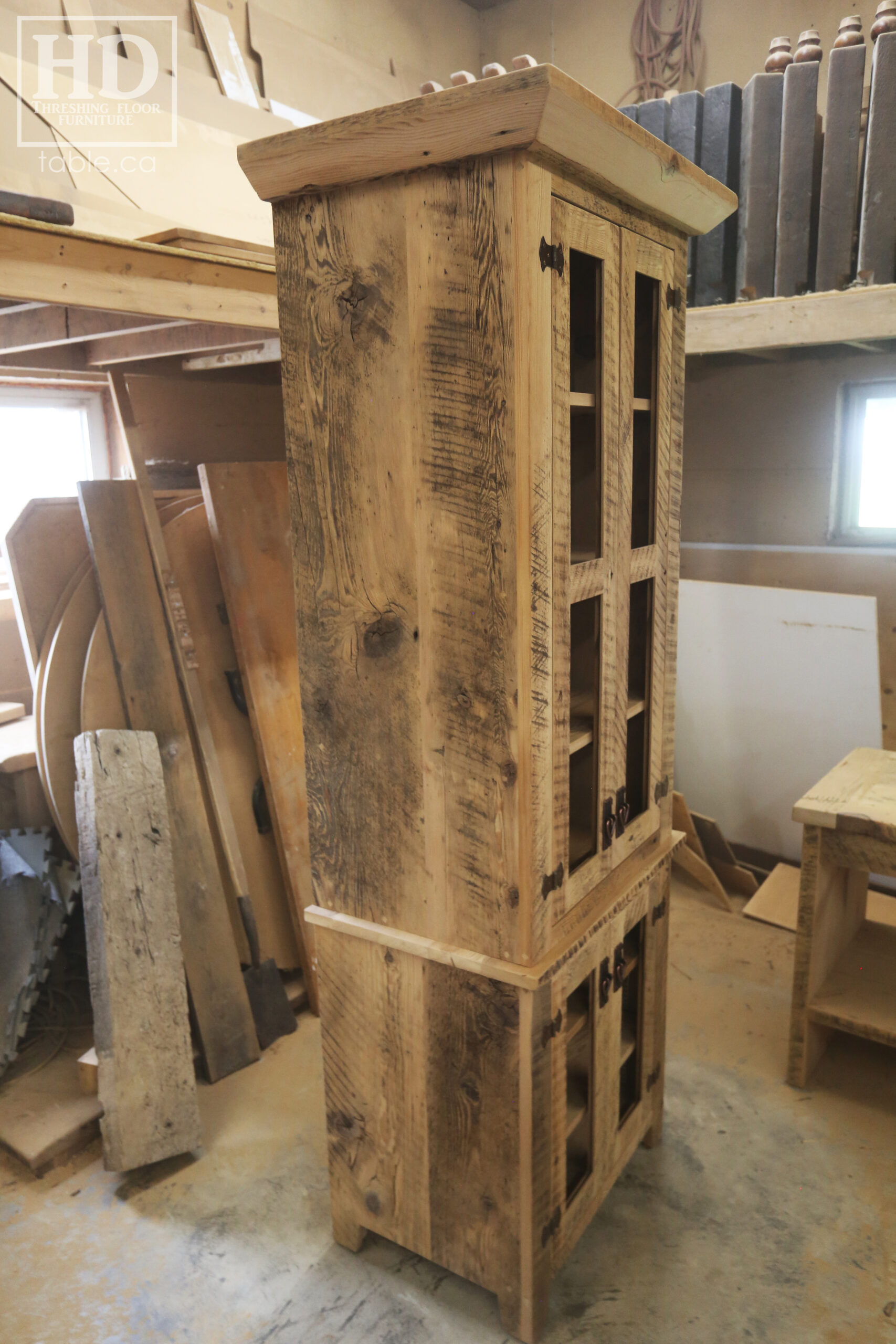 33" Wide Ontario Barnwood Hutch we made for a Guelph Home - 84" height - 20" deep - 2 Top Doors / 2 Bottom Doors / Glass Inserts - Ajustable Shelving Inside - Reclaimed old growth hemlock threshing floor + grainery board construction - Original edges + distressing kept - Mission Cast Brass Lee Valley Hardware - Satin polyurethane finish - www.table.ca