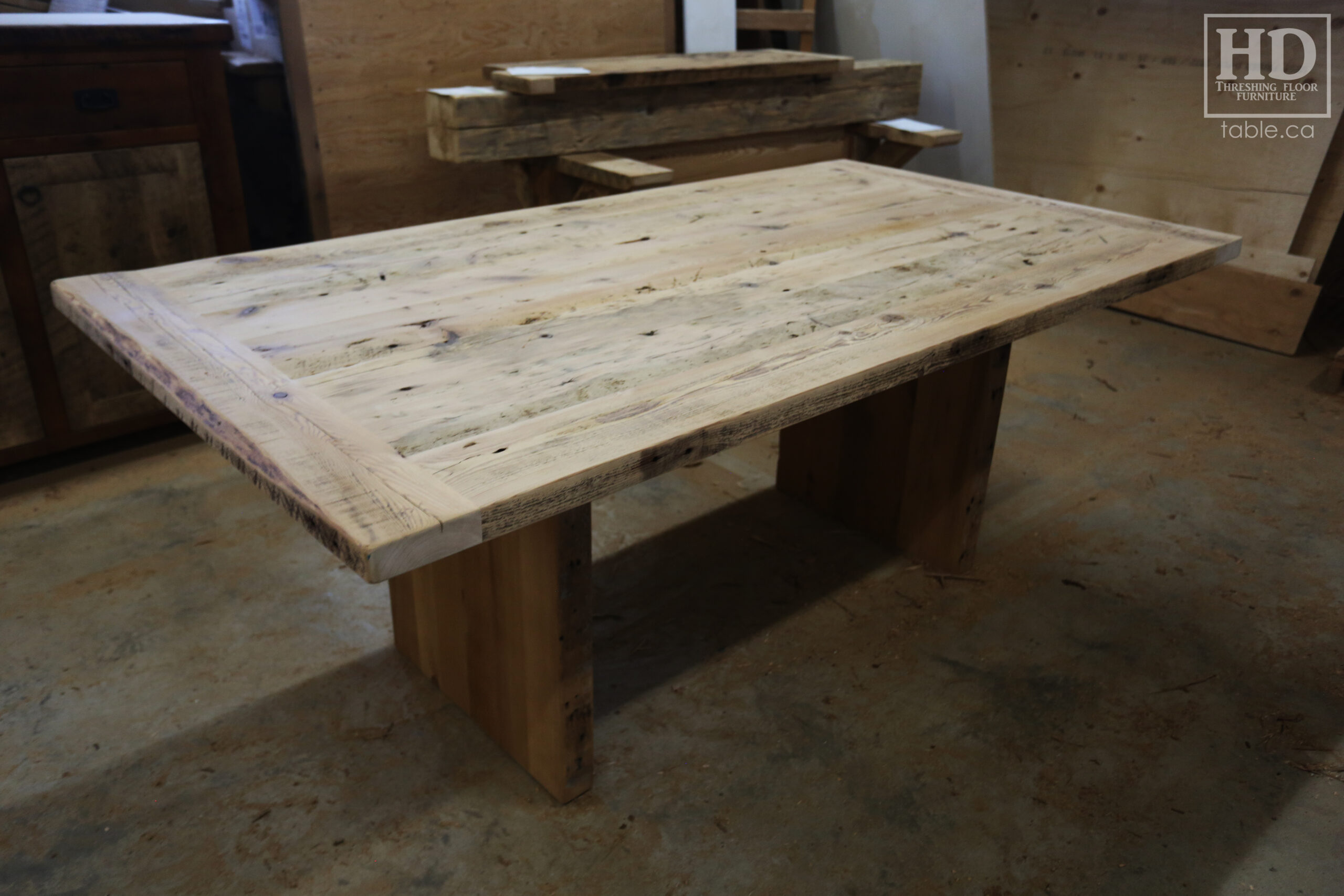 6.5' Ontario Barnwood Table we made for a Brantford Home - 42" wide - Modern Plank Posts Base - Old Growth Hemlock Threshing Floor Construction - Original edges & distressing maintained - Bleached Option - Premium epoxy + satin polyurethane finish - www.table.ca