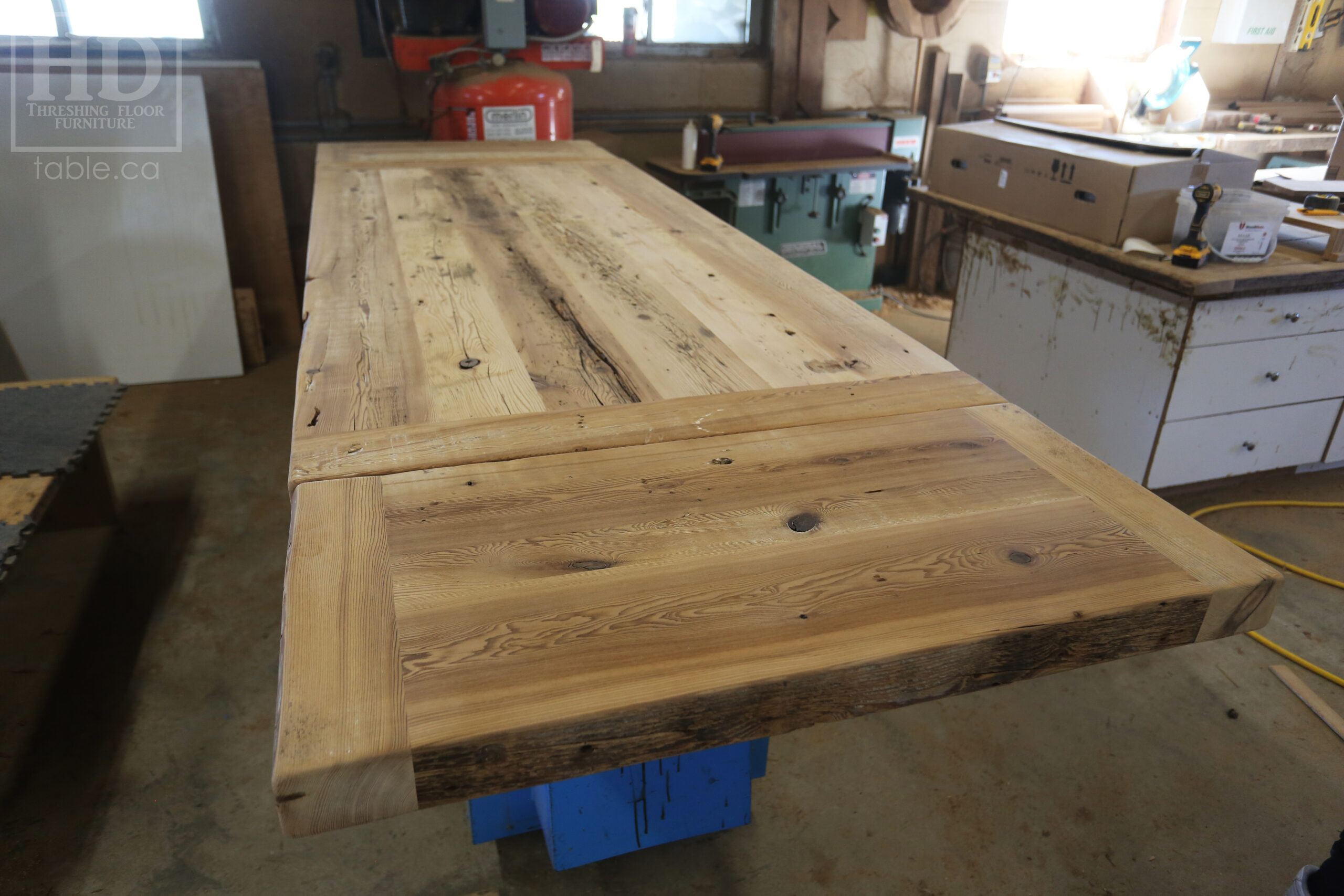 7' Reclaimed Ontario Barnwood Table we made for a Goderich home - 39" wide - 36" height - 3" Joist Material Top Option - Metal U Shaped Matte Black Base - Old Growth Hemlock Threshing Floor Construction - Original edges & distressing maintained - Premium epoxy + satin polyurethane finish - Two 18" Leaves - www.table.ca