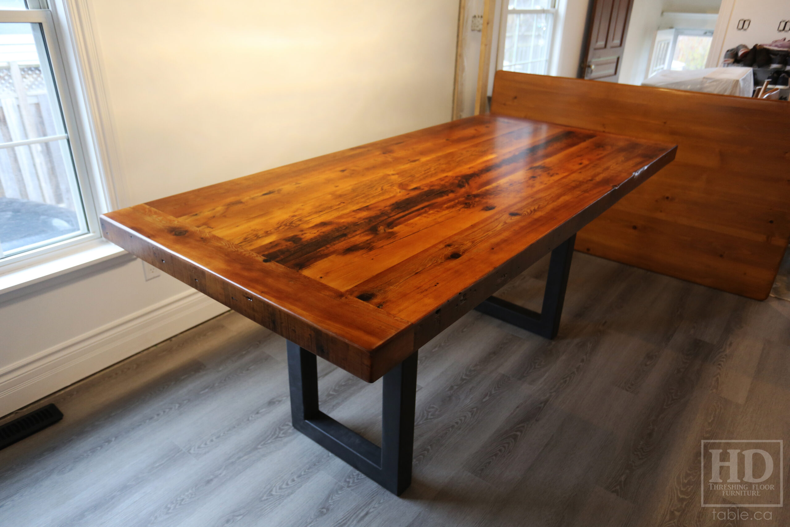 7' Reclaimed Ontario Barnwood Table we made for a Goderich home - 39" wide - 36" height - 3" Joist Material Top Option - Metal U Shaped Matte Black Base - Old Growth Hemlock Threshing Floor Construction - Original edges & distressing maintained - Premium epoxy + satin polyurethane finish - Two 18" Leaves - www.table.ca