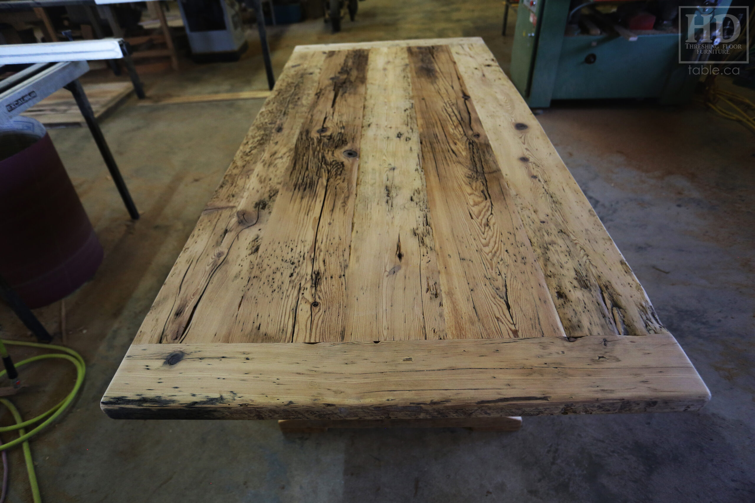 6.5' Reclaimed Ontario Barnwood Table we made for a Grismby home - 36" deep - Trestle Base - Old Growth Hemlock Threshing Floor Construction - Original edges & distressing maintained - Black Stain Option - Premium epoxy + matte polyurethane finish - [2] Matching 6.5' Benches - [2] Plank Back Chairs / Wormy Maple - www.table.ca