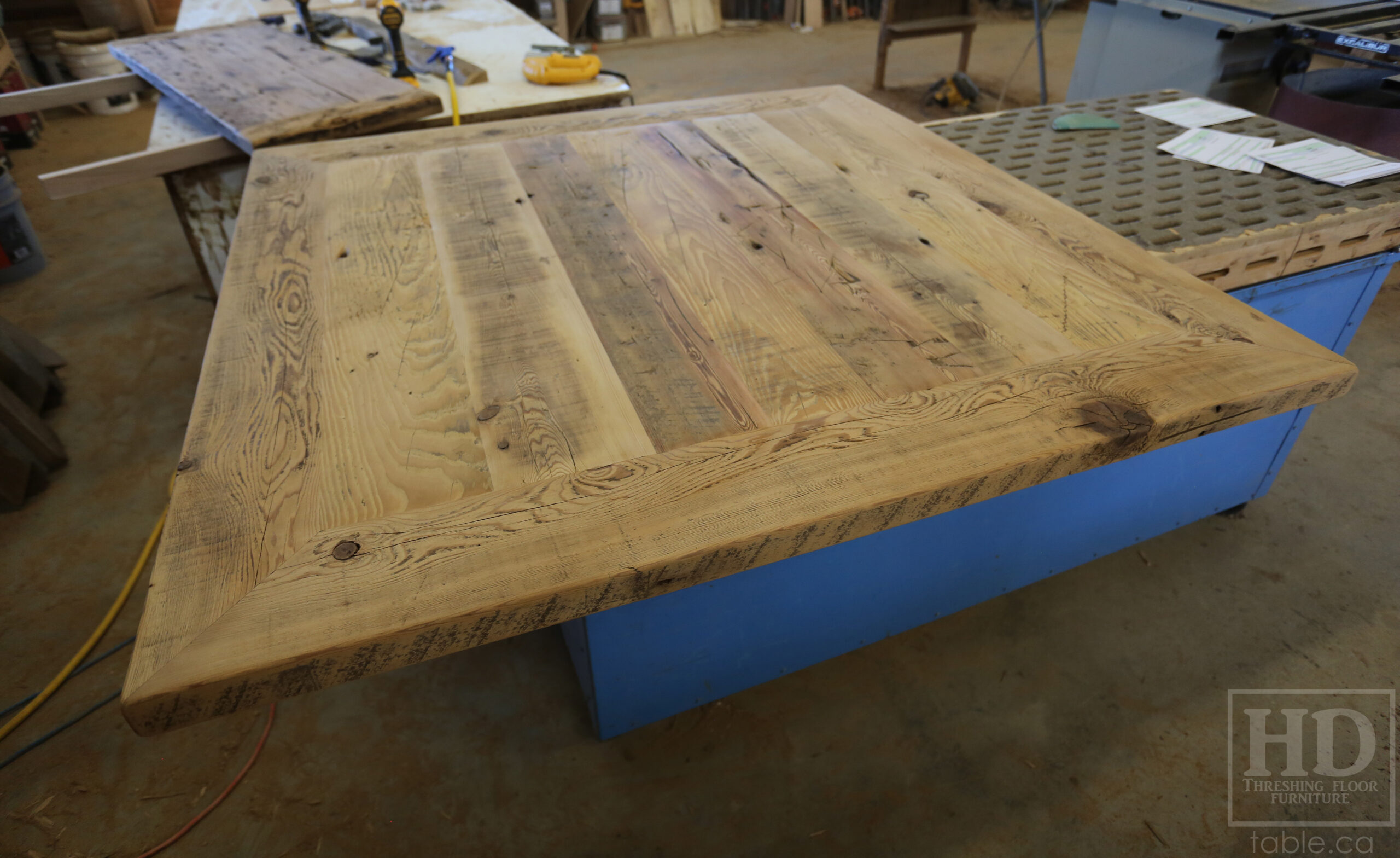 50" x 50" Ontario Barnwood Table we made for a Toronto Company - X Shaped Metal Base - Mitred Corners - Reclaimed Old Growth Hemlock Threshing Floor Construction - Original edges & distressing maintained - Premium epoxy + satin polyurethane finish  - One 18" Leaf Extension - www.table.ca