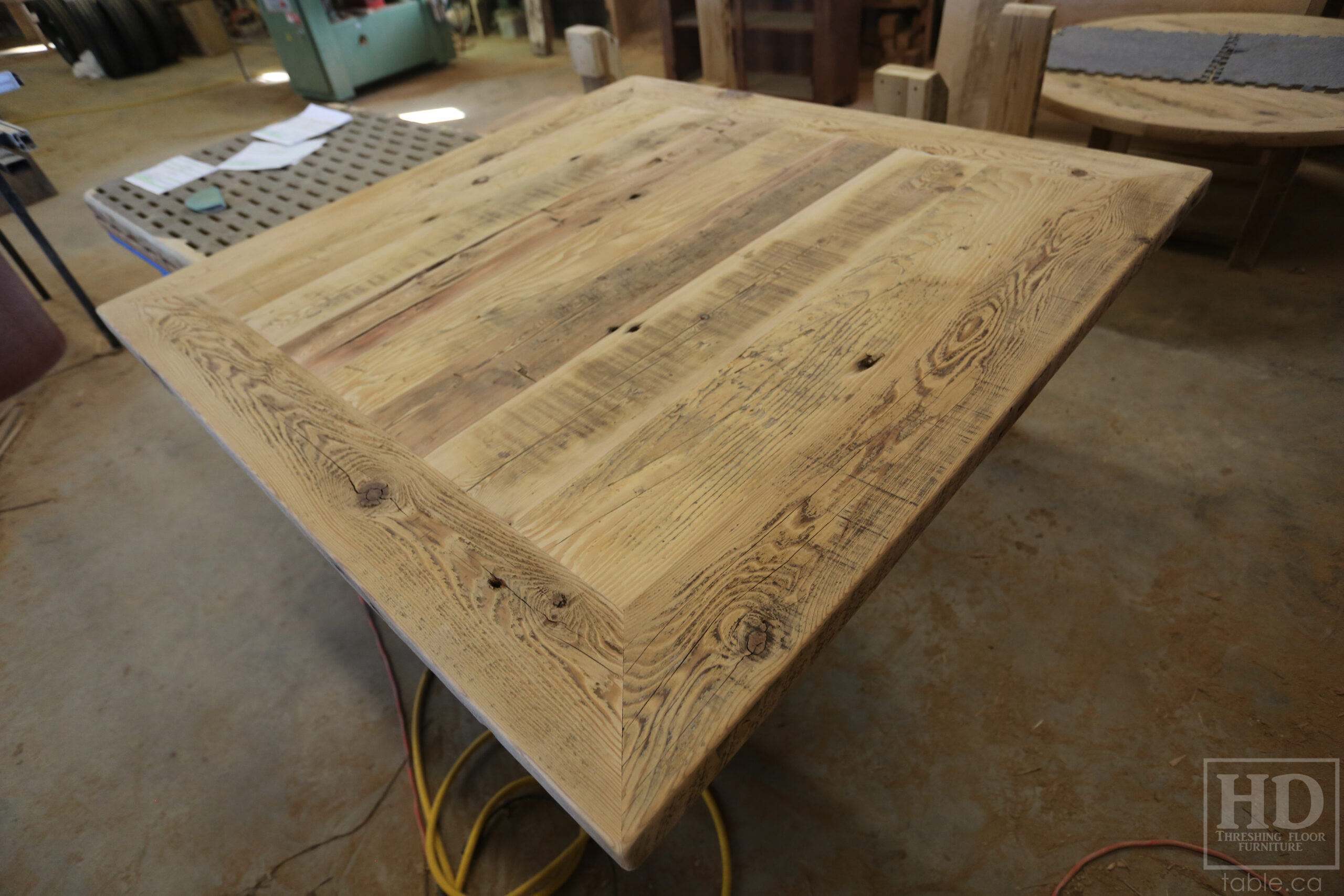 50" x 50" Ontario Barnwood Table we made for a Toronto Company - X Shaped Metal Base - Mitred Corners - Reclaimed Old Growth Hemlock Threshing Floor Construction - Original edges & distressing maintained - Premium epoxy + satin polyurethane finish  - One 18" Leaf Extension - www.table.ca