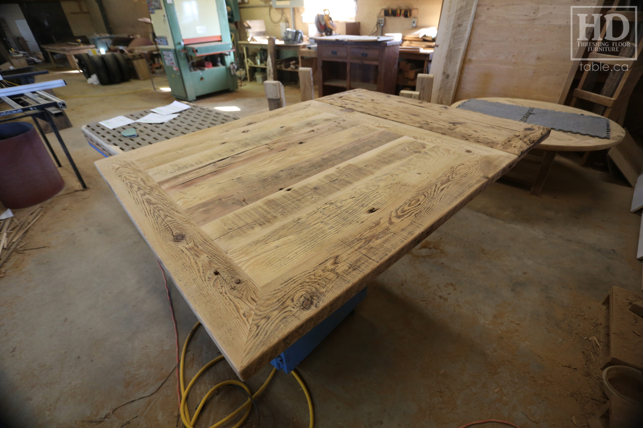 50" x 50" Ontario Barnwood Table we made for a Toronto Company - X Shaped Metal Base - Mitred Corners - Reclaimed Old Growth Hemlock Threshing Floor Construction - Original edges & distressing maintained - Premium epoxy + satin polyurethane finish  - One 18" Leaf Extension - www.table.ca