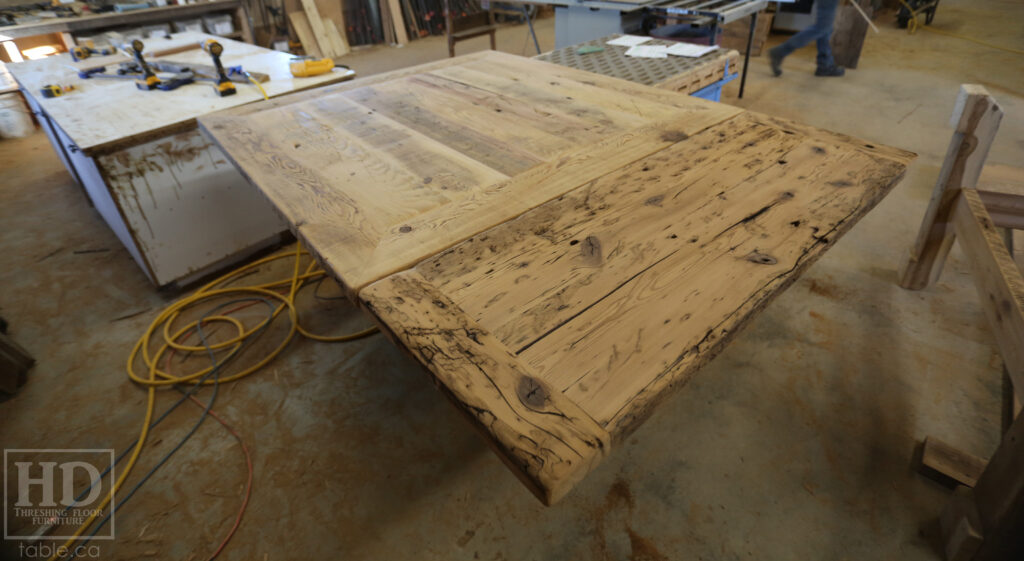 50" x 50" Ontario Barnwood Table we made for a Toronto Company - X Shaped Metal Base - Mitred Corners - Reclaimed Old Growth Hemlock Threshing Floor Construction - Original edges & distressing maintained - Premium epoxy + satin polyurethane finish  - One 18" Leaf Extension - www.table.ca