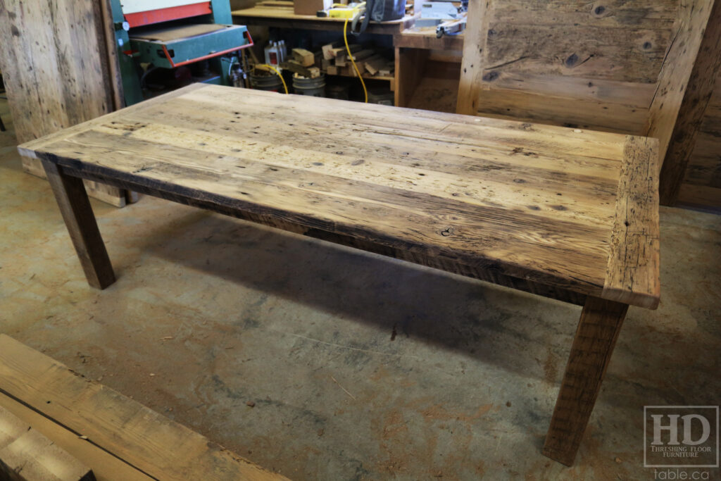 8' Reclaimed Ontario Barnwood Table we made for a Branchton home - 44" deep - Harvest Base: Straight 4"x4" Windbrace Beam Legs Option - Old Growth Hemlock Threshing Floor Construction - Original edges & distressing maintained - Premium epoxy + matte polyurethane finish - Speciality Colour: Custom Barnboard Grey - 8 Modified Plank Back Chairs / Wormy Maple / Black with Sandthroughs / Polyurethane clearcoat finish - www.table.ca