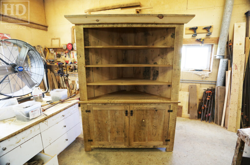 Reclaimed Ontario Barnwood Corner Hutch we made for a Vienna home - 7' Height / 3'10" Wide - Bottom Doors/ Top Shelving - Old Growth Pine Threshing Floor + Grainery Board Construction - Original edges & distressing maintained - Mission Cast Brass Lee Valley Hardware - Polyurethane clearcoat finish - www.table.ca