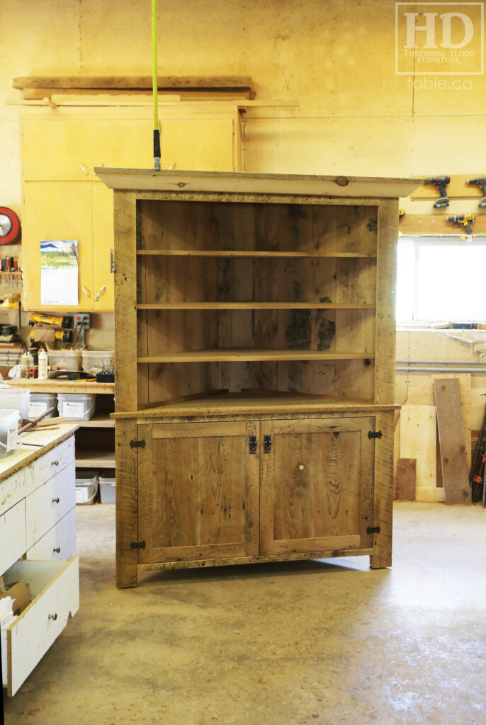 Reclaimed Ontario Barnwood Corner Hutch we made for a Vienna home - 7' Height / 3'10" Wide - Bottom Doors/ Top Shelving - Old Growth Pine Threshing Floor + Grainery Board Construction - Original edges & distressing maintained - Mission Cast Brass Lee Valley Hardware - www.table.ca