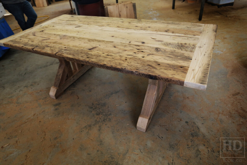 7' Reclaimed Ontario Barnwood Table we made for a Rockwood home - 42" wide - Customized Sawbuck Base - Old Growth Hemlock Threshing Floor Construction - Bread Board Ends - Original edges & distressing maintained - Greytone Option - Premium epoxy + satin polyurethane finish - www.table.ca