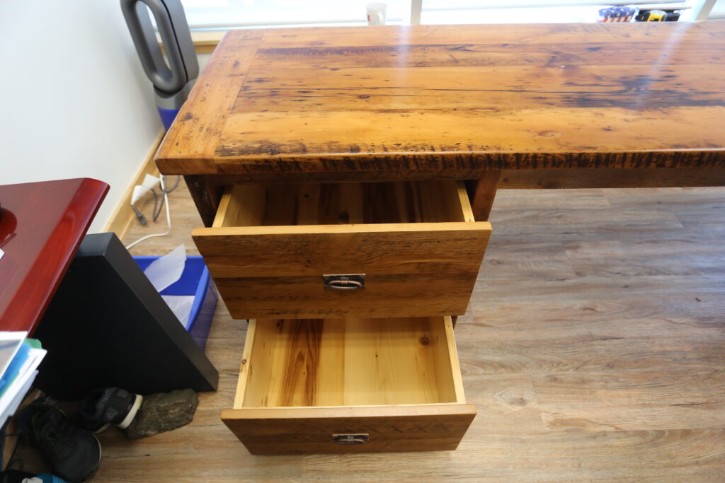 84" Ontario Barnwood Desk we made for a Toronto office - 40" deep - 96" Return / 24" deep - Gable End - Corner Post - 2 drawers on return side - Reclaimed Old Growth Hemlock Threshing Floor + Grainery Board Construction - Original edges + distressing maintained - Mission Cast Brass Lee Valley Hardware - Premium epoxy + satin polyurethane finish - www.table.ca