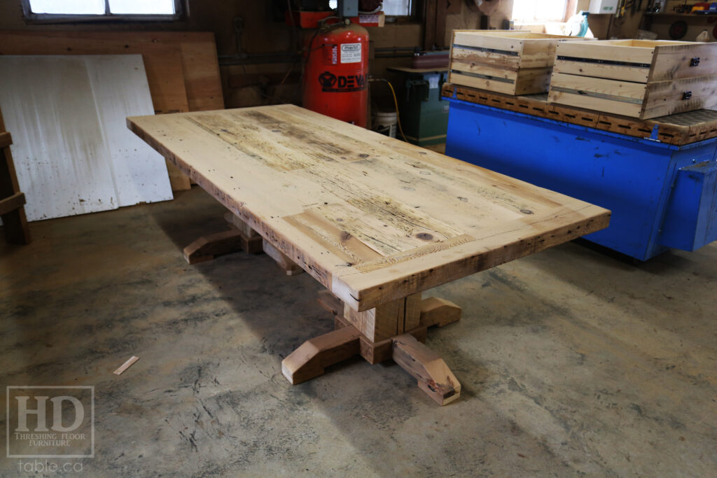 8.5' Ontario Barnwood Table Set we made for a Muskoka cottage - 46" wide - 3" [extra thick option] Joist Material Top - Hand-Hewn Pedestals Base - Reclaimed Hemlock Threshing Floor Construction - Original edges + distressing maintained - Premium epoxy + satin polyurethane finish - 10 Non-arm Topgrain Leather Parsons Chairs / 2 arm " " / Santiago Ruby - www.table.ca