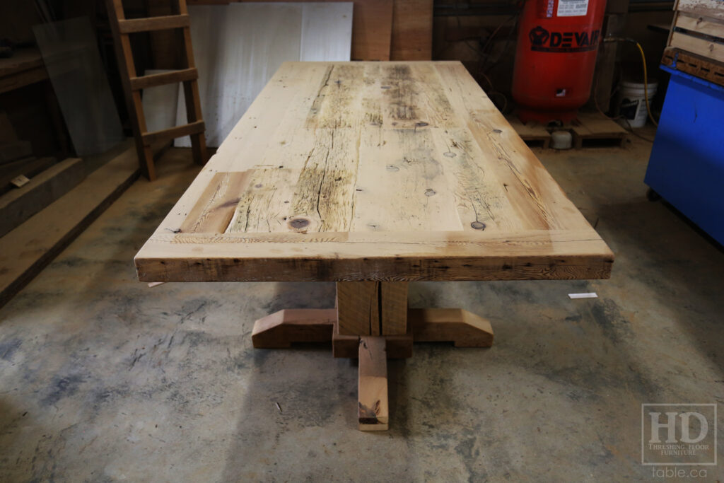 8.5' Ontario Barnwood Table Set we made for a Muskoka cottage - 46" wide - 3" [extra thick option] Joist Material Top - Hand-Hewn Pedestals Base - Reclaimed Hemlock Threshing Floor Construction - Original edges + distressing maintained - Premium epoxy + satin polyurethane finish - 10 Non-arm Topgrain Leather Parsons Chairs / 2 arm " " / Santiago Ruby - www.table.ca