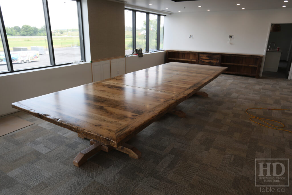 17' Reclaimed Ontario Barnwood Table we made for a Quinte West marketplace - 6' Wide - Extra thick 3" Top Option - Hand Hewn Beam Pedestals Base - Old Growth Hemlock Threshing Floor Construction - Original edges & distressing maintained - Premium epoxy + satin polyurethane finish - Custom Metal Graphic Logo Embedded - Greytone Option - 3 part on site final doweling option - www.table.ca
