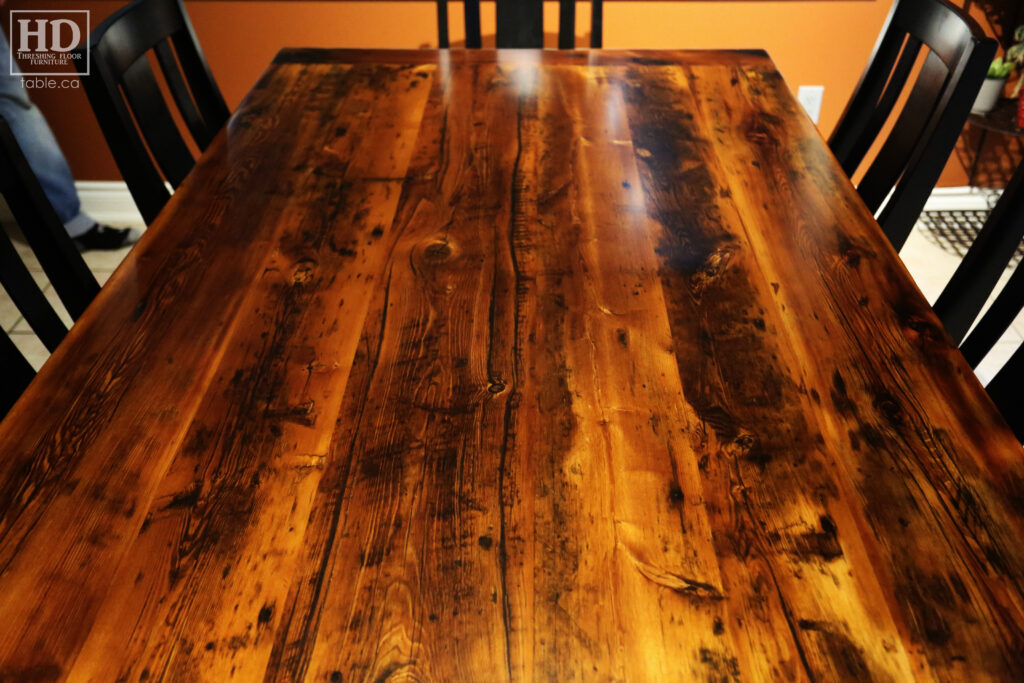 6' Reclaimed Ontario Barnwood Table we made for a Richmond Hill, Ontario home - 42" wide - Harvest Base: Tapered with a Notch Windbrace Beam Legs - Black Painted Base - Old Growth Hemlock Threshing Floor Construction - Original edges & distressing maintained - Premium epoxy + satin polyurethane finish - Modified Plank Back Chairs / Wormy Maple / Polyurethane clearcoat finish - www.table.ca