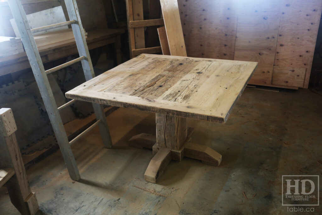 48" x 48" Ontario Barnwood Table we made for an Oakville home - Hand-Hewn Pedestal Post - Old Growth Reclaimed Hemlock Threshing Floor Construction - Original edges & distressing maintained - Premium epoxy + satin polyurethane finish - 4 Plank Back Chairs / Wormy Maple / Painted Solid Black - www.table.ca