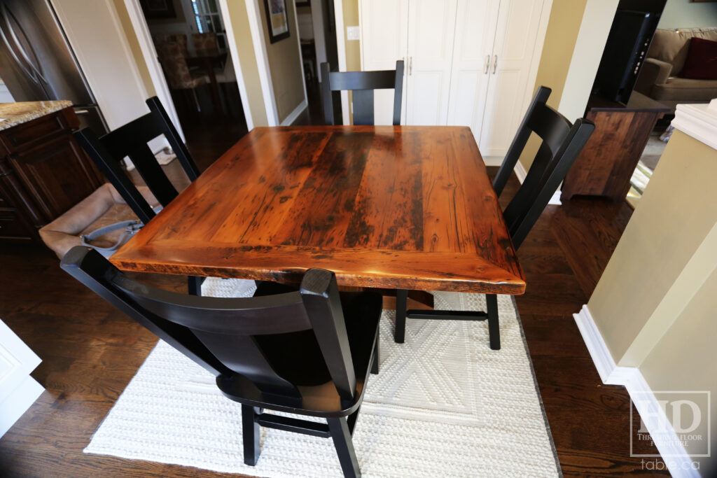 48" x 48" Ontario Barnwood Table we made for an Oakville home - Hand-Hewn Pedestal Post - Old Growth Reclaimed Hemlock Threshing Floor Construction - Original edges & distressing maintained - Premium epoxy + satin polyurethane finish - 4 Plank Back Chairs / Wormy Maple / Painted Solid Black - www.table.ca