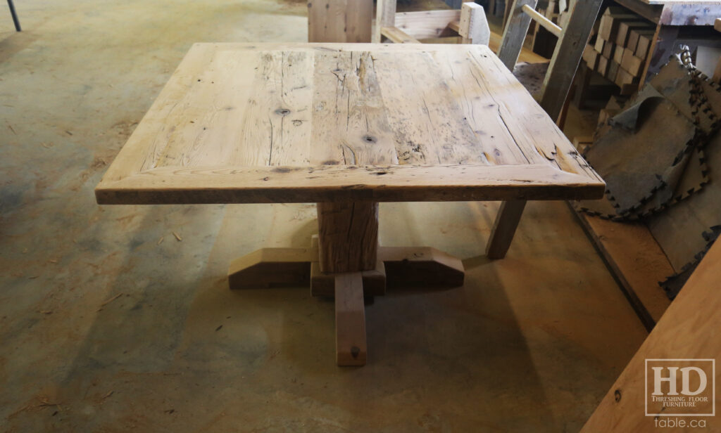 48" x 48" Ontario Barnwood Table we made for an Oakville home - Hand-Hewn Pedestal Post - Old Growth Reclaimed Hemlock Threshing Floor Construction - Original edges & distressing maintained - Premium epoxy + satin polyurethane finish - 4 Plank Back Chairs / Wormy Maple / Painted Solid Black - www.table.ca