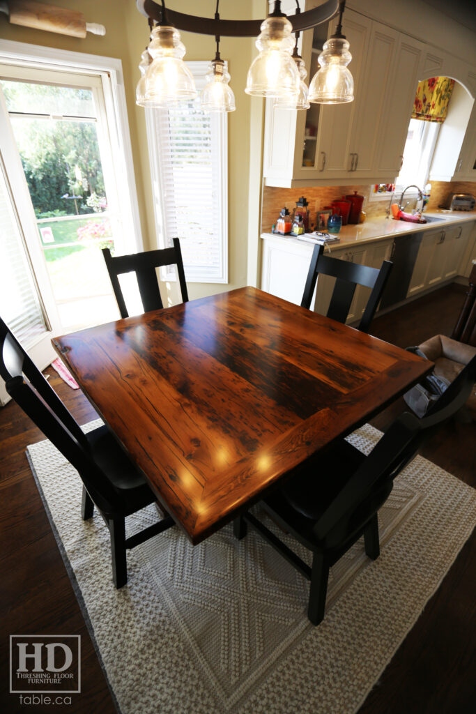 48" x 48" Ontario Barnwood Table we made for an Oakville home - Hand-Hewn Pedestal Post - Old Growth Reclaimed Hemlock Threshing Floor Construction - Original edges & distressing maintained - Premium epoxy + satin polyurethane finish - 4 Plank Back Chairs / Wormy Maple / Painted Solid Black - www.table.ca