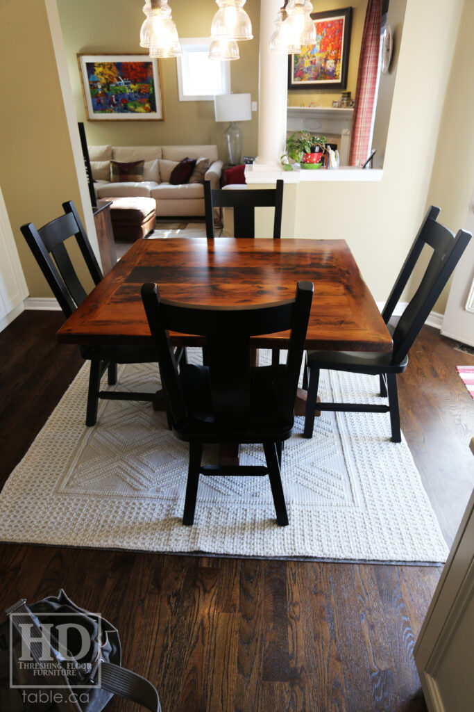 48" x 48" Ontario Barnwood Table we made for an Oakville home - Hand-Hewn Pedestal Post - Old Growth Reclaimed Hemlock Threshing Floor Construction - Original edges & distressing maintained - Premium epoxy + satin polyurethane finish - 4 Plank Back Chairs / Wormy Maple / Painted Solid Black - www.table.ca