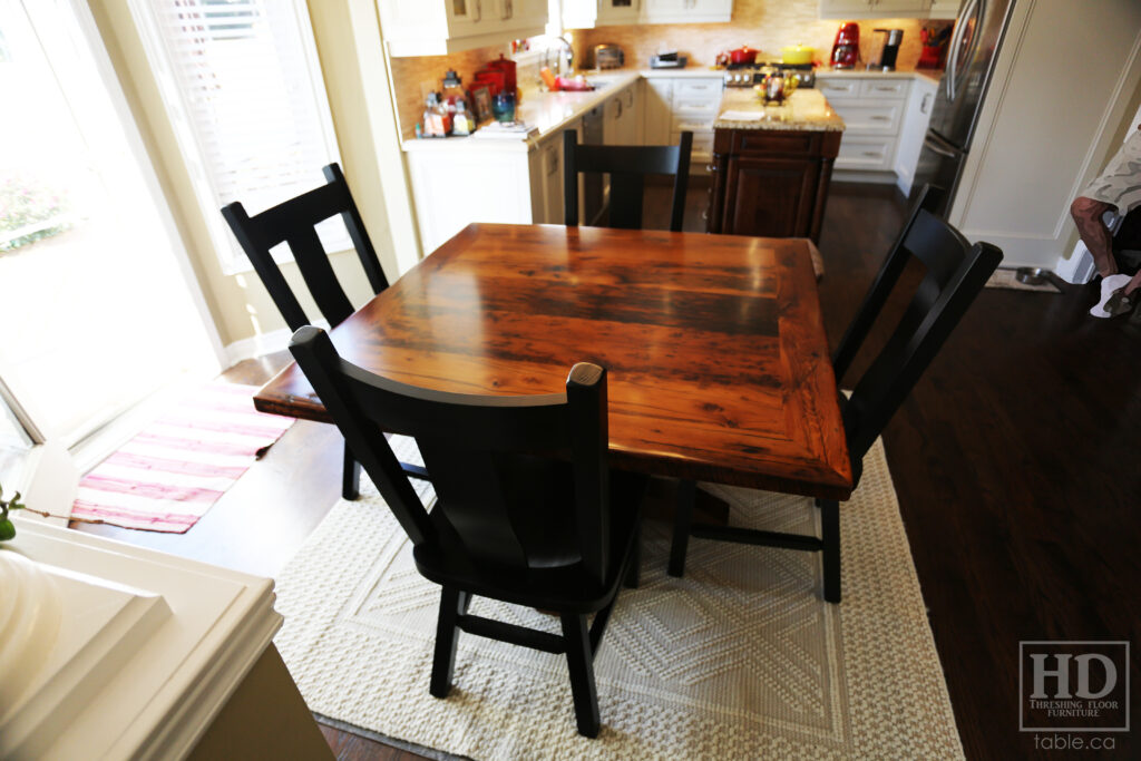 48" x 48" Ontario Barnwood Table we made for an Oakville home - Hand-Hewn Pedestal Post - Old Growth Reclaimed Hemlock Threshing Floor Construction - Original edges & distressing maintained - Premium epoxy + satin polyurethane finish - 4 Plank Back Chairs / Wormy Maple / Painted Solid Black - www.table.ca