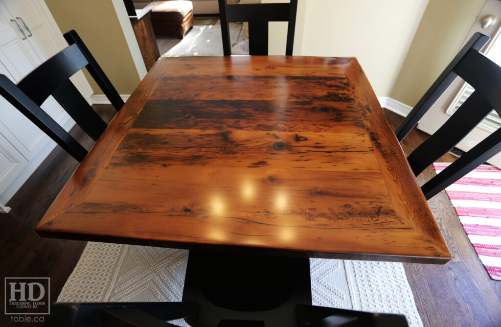 48" x 48" Ontario Barnwood Table we made for an Oakville home - Hand-Hewn Pedestal Post - Old Growth Reclaimed Hemlock Threshing Floor Construction - Original edges & distressing maintained - Premium epoxy + satin polyurethane finish - 4 Plank Back Chairs / Wormy Maple / Painted Solid Black - www.table.ca