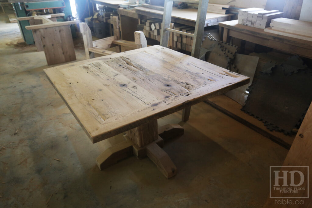 48" x 48" Ontario Barnwood Table we made for an Oakville home - Hand-Hewn Pedestal Post - Old Growth Reclaimed Hemlock Threshing Floor Construction - Original edges & distressing maintained - Premium epoxy + satin polyurethane finish - 4 Plank Back Chairs / Wormy Maple / Painted Solid Black - www.table.ca