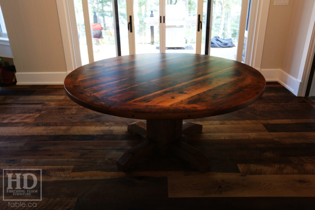 66" Reclaimed Ontario Barnwood Round Table we made for a Bigwin Island Cottage - Hand-Hewn Beam Pedestal Base - Old Growth Hemlock Threshing Floor Construction - Original edges & distressing maintained - Premium epoxy + satin polyurethane finish - www.table.ca
