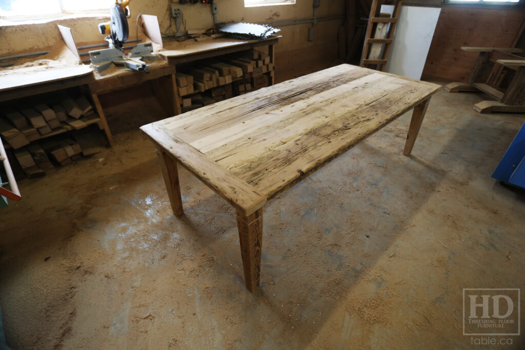 8' Reclaimed Ontario Barnwood Table we made for a Hepworth home - 42" wide - Harvest Base: Tapered with a Notch Windbrace Beam Legs - Old Growth Hemlock Threshing Floor Construction - Original edges & distressing maintained - Premium epoxy + matte polyurethane finish - www.table.ca