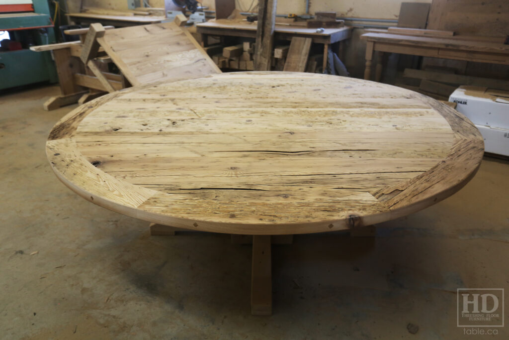 84" Reclaimed Ontario Barnwood Round Table we made for a Dundas office - Old Growth Hemlock Threshing Floor Construction - Hand-Hewn Beam Base Option - Black Stain Option - Original edges + distressing maintained - Premium epoxy + matte polyurethane finish - www.table.ca