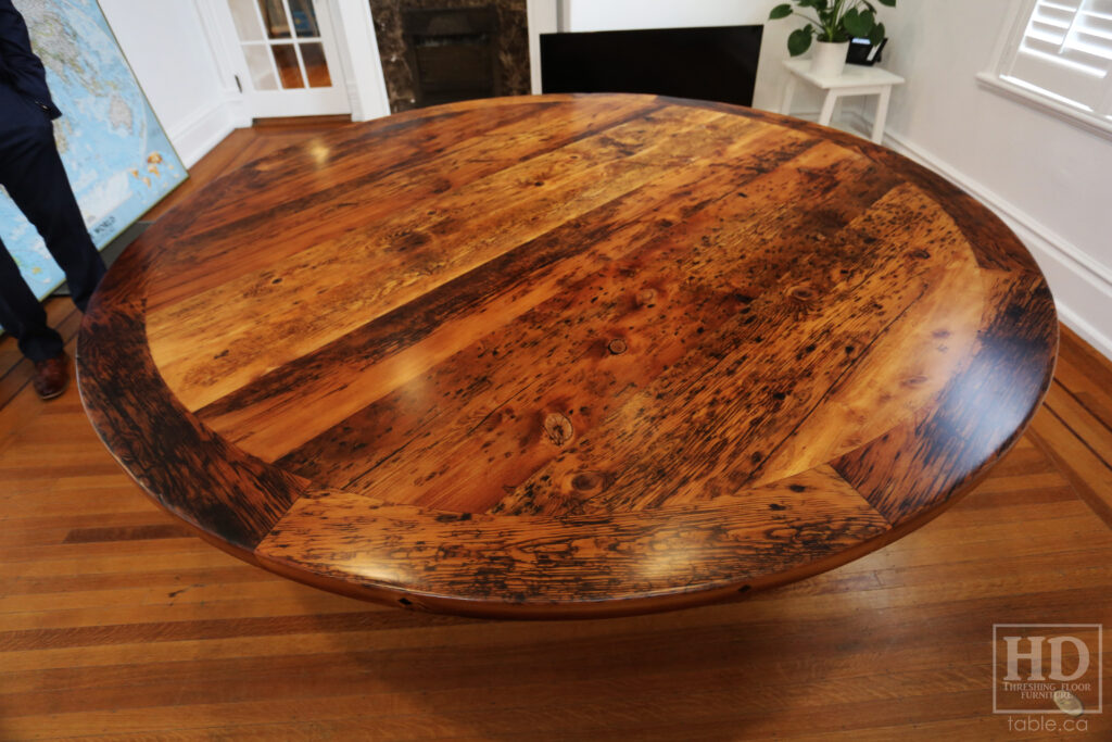 84" Reclaimed Ontario Barnwood Round Table we made for a Dundas office - Old Growth Hemlock Threshing Floor Construction - Hand-Hewn Beam Base Option - Black Stain Option - Original edges + distressing maintained - Premium epoxy + matte polyurethane finish - www.table.ca